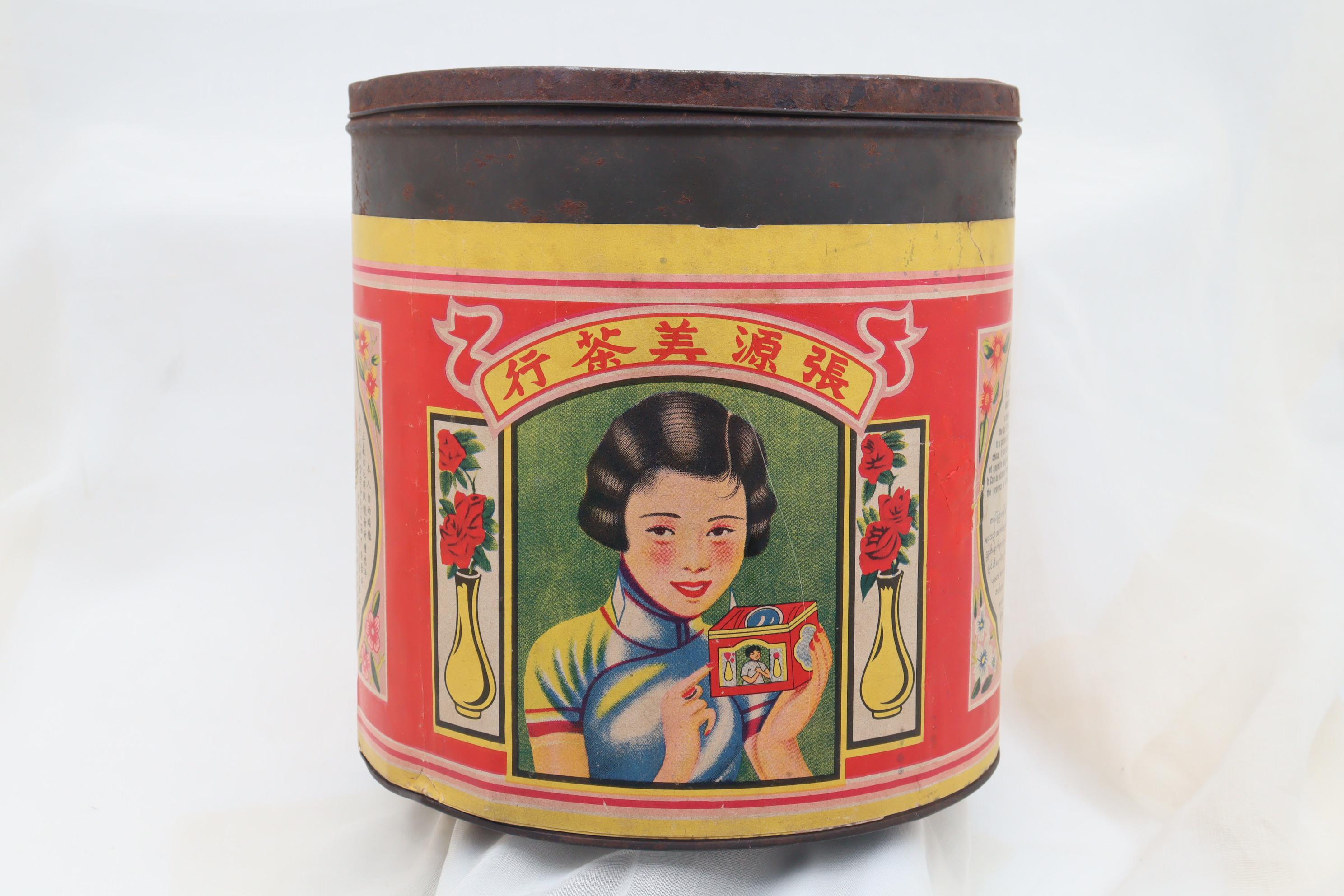 This very decorative tea tin was made for the Burmese market with text in Chinese, English and Burmese. It was shipped from Amoy (now Xiamem) in China to be sold in the retail store in Rangoon (now Yangon). It appears to have lost the paper label to