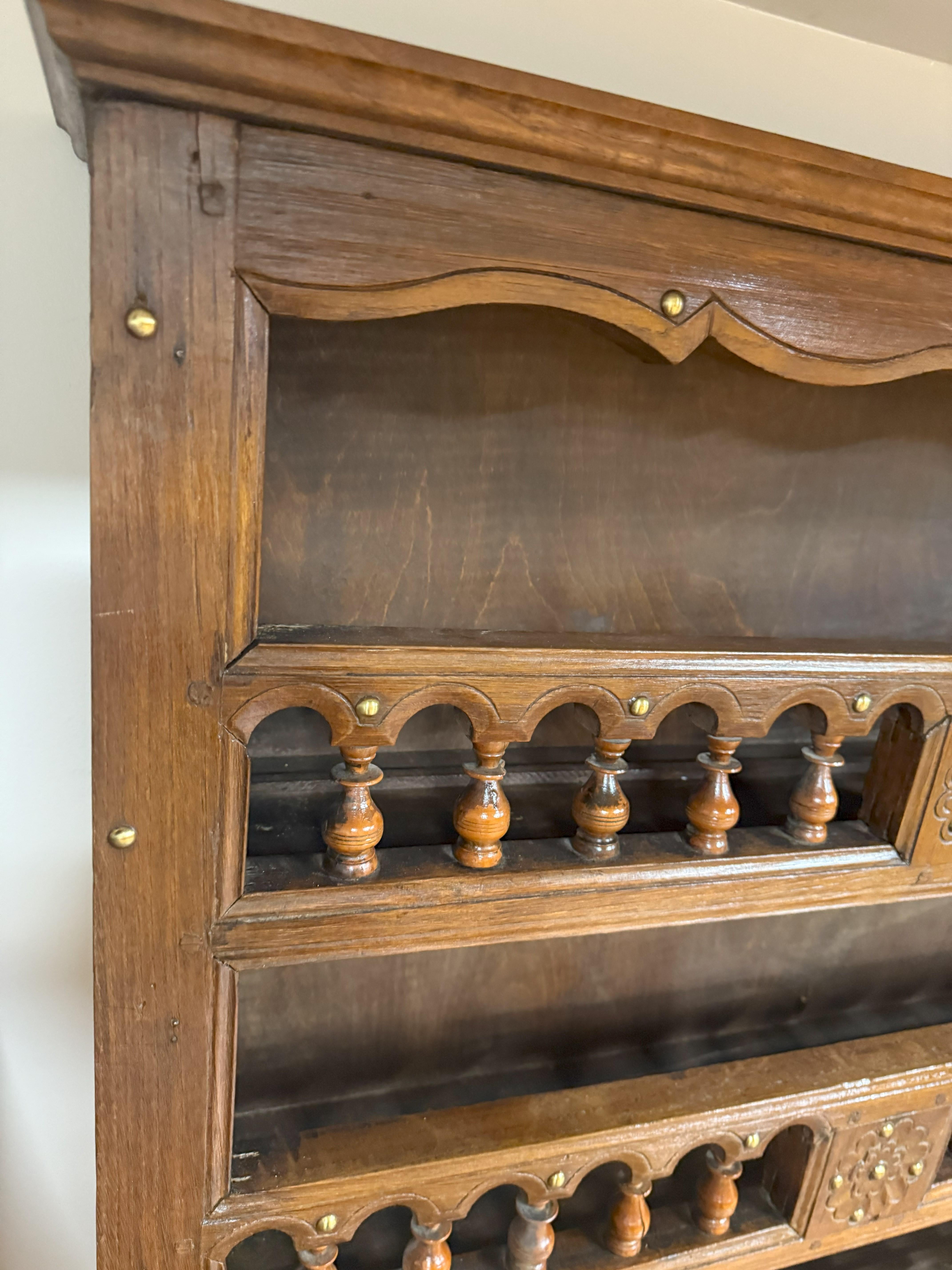 Very Decorative Early 19th-century French Provincial Plate Rack. Made of richly patinated chestnut with small decorative turned apple wood spindles and brass nail decorations. Typical design of Breton Domestic Furniture and made circa 1840.

A