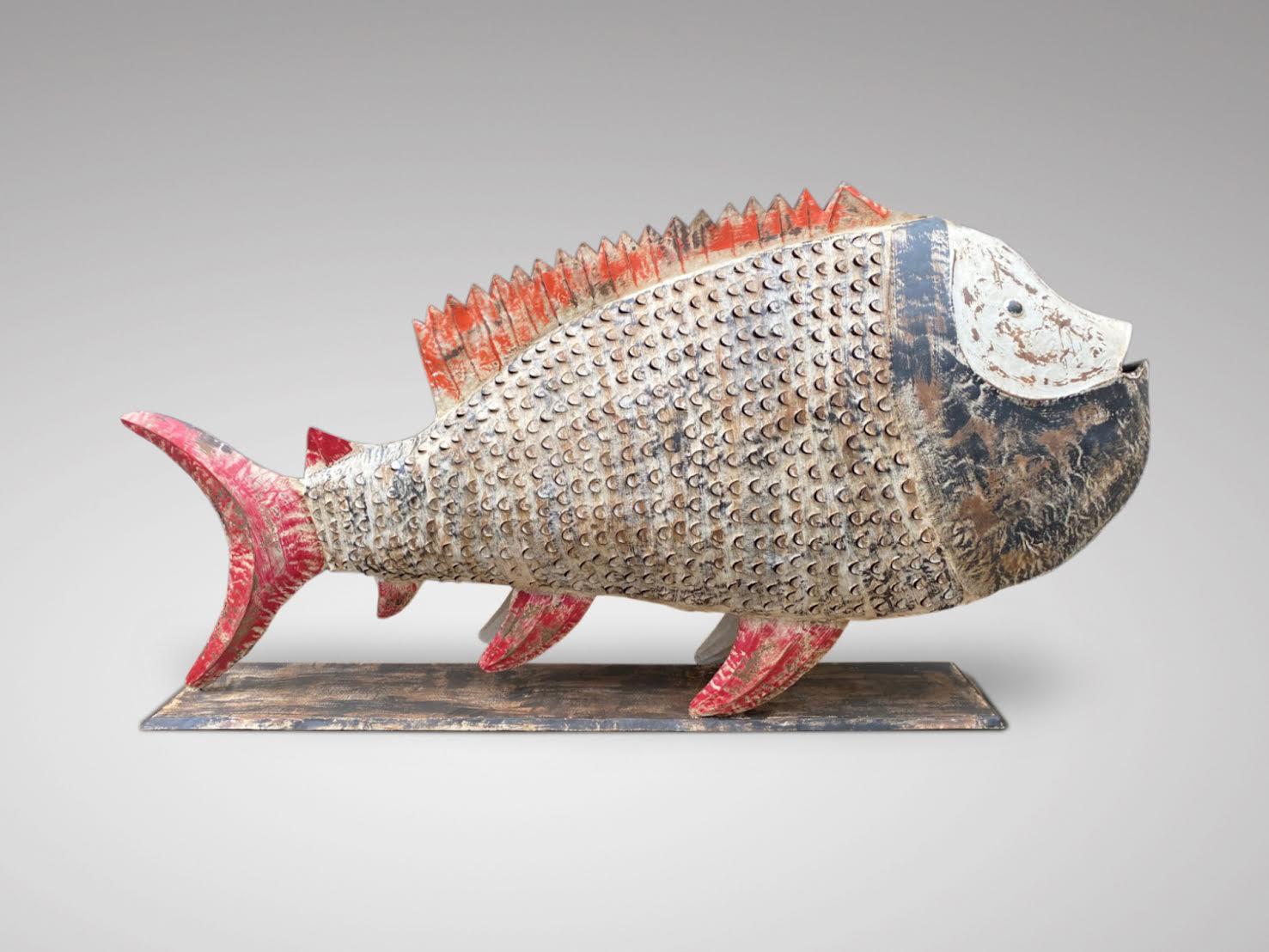 A very decorative large coloured painted metal fish with candleholder. This beautiful fish made by a Jodhpur ironworker is painted and patinated by hand. Wonderful decorative object, it will allow you to decorate your garden or even your living
