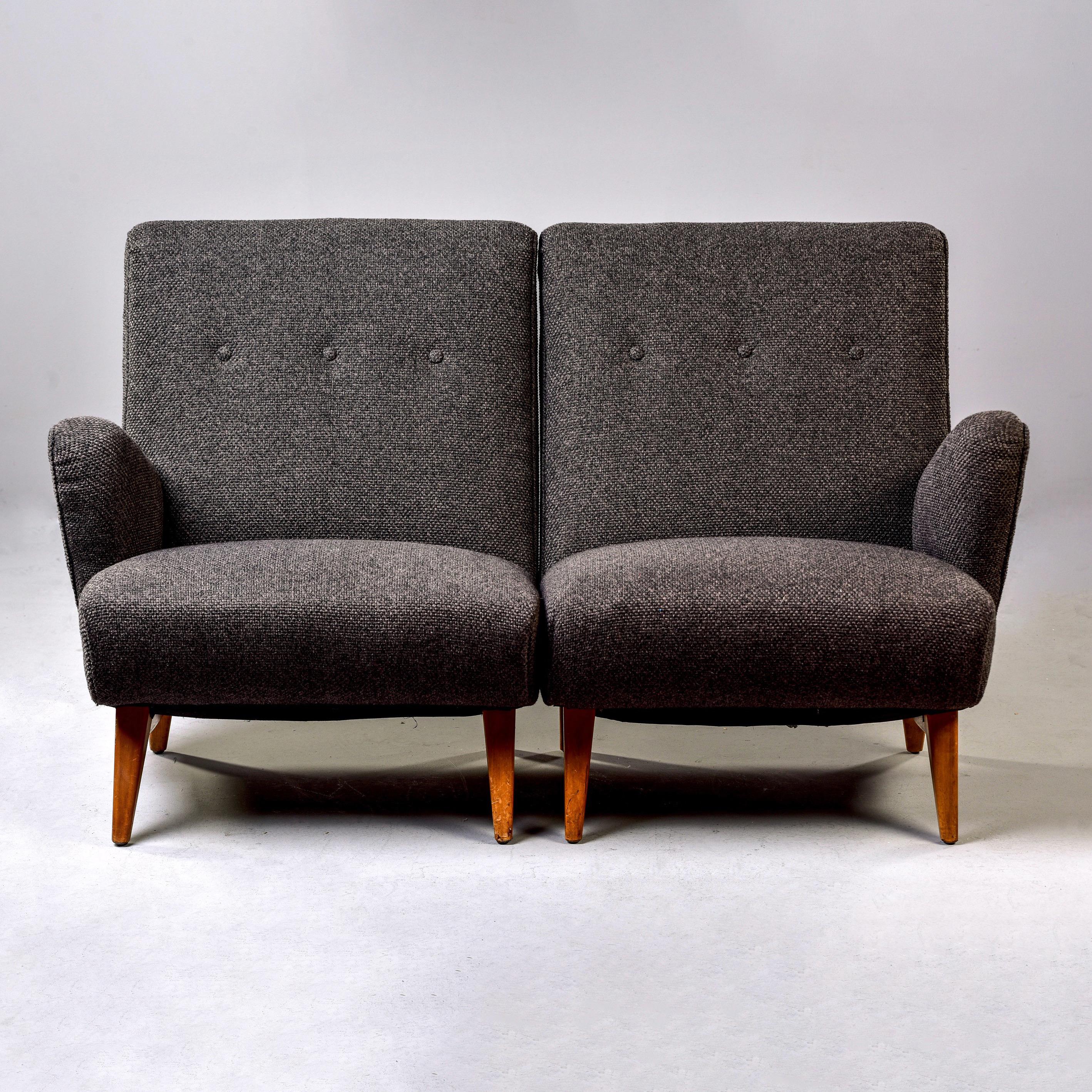 Circa 1948 two piece settee or pair of one arm chairs designed by Jens Risom for Knoll. These are extremely solid and comfortable pieces, well-built with hand-tied springs, tufted seat backs, angled arms and legs. This has been professionally