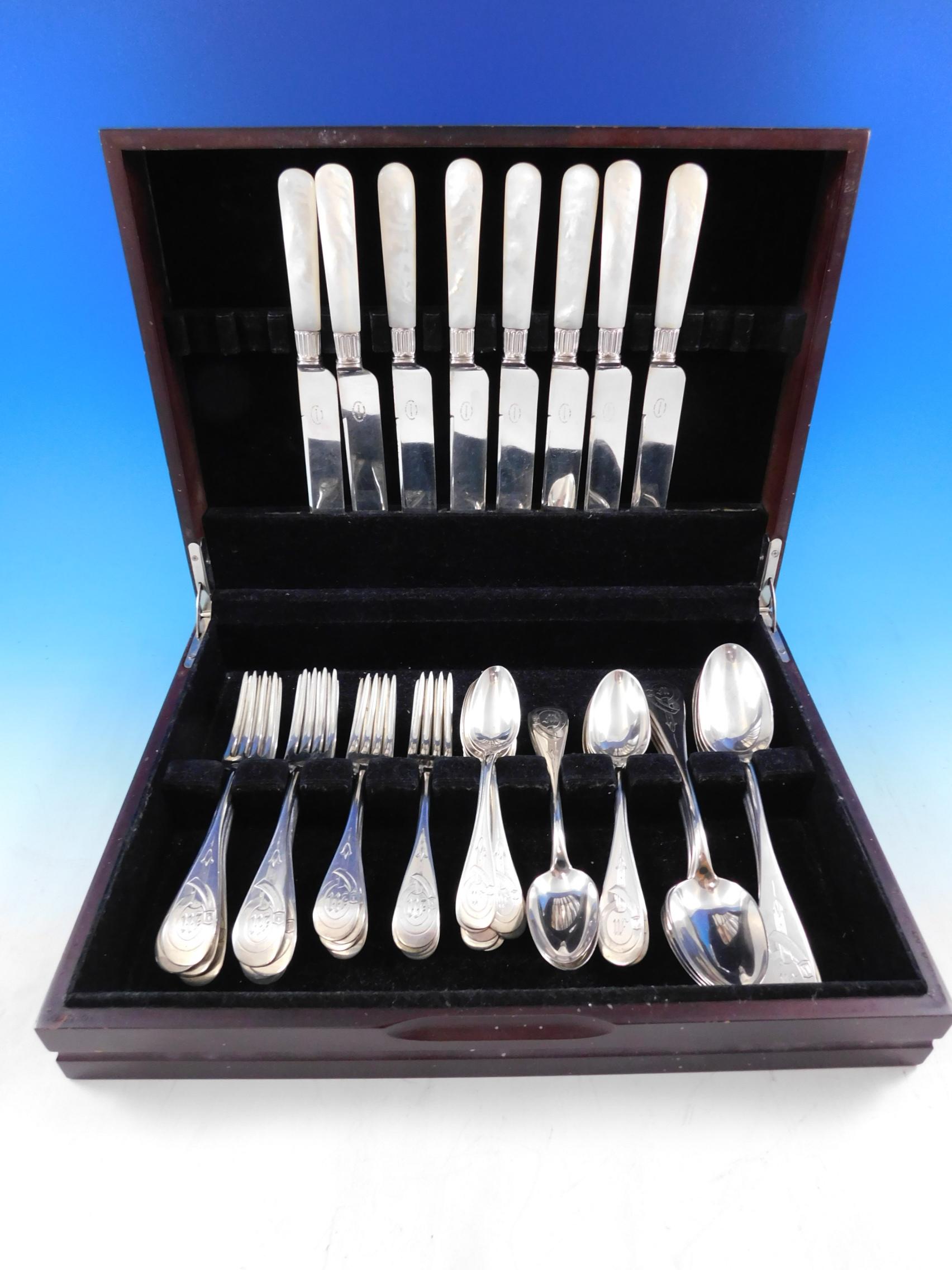 Equestrian motif silver flatware set - 48 pieces. This early service includes:

8 knives, mother of pearl handles with sterling ferrules and plated blunt blades, 8 5/8