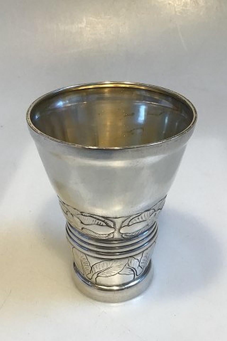 Very early Georg Jensen Beaker in silver from 1905.

Measures: 11.1cm high and 8.3cm in diameter top

Weight is 141 grams / 5 oz.

With French import marks.

Item no.: 450567.