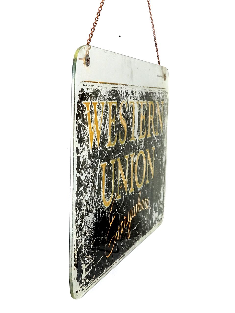 This is the earliest Western Union sign we have ever come across. I'm guessing it dates to circa 1870s. Its hand painted on glass heavy glass. The rounded corners are all hand shaped. The patina is amazing... this is a real survivor.