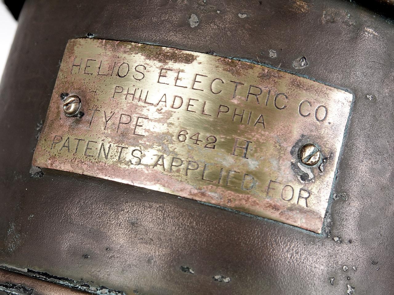 I believe this was lamp was an 1800s carbon arch street lamp. This seldom seen Helios was from the beginning of electric lighting. We have left the original insides if the lamp intact and wired around it to take a standard bulb. It is signed on a