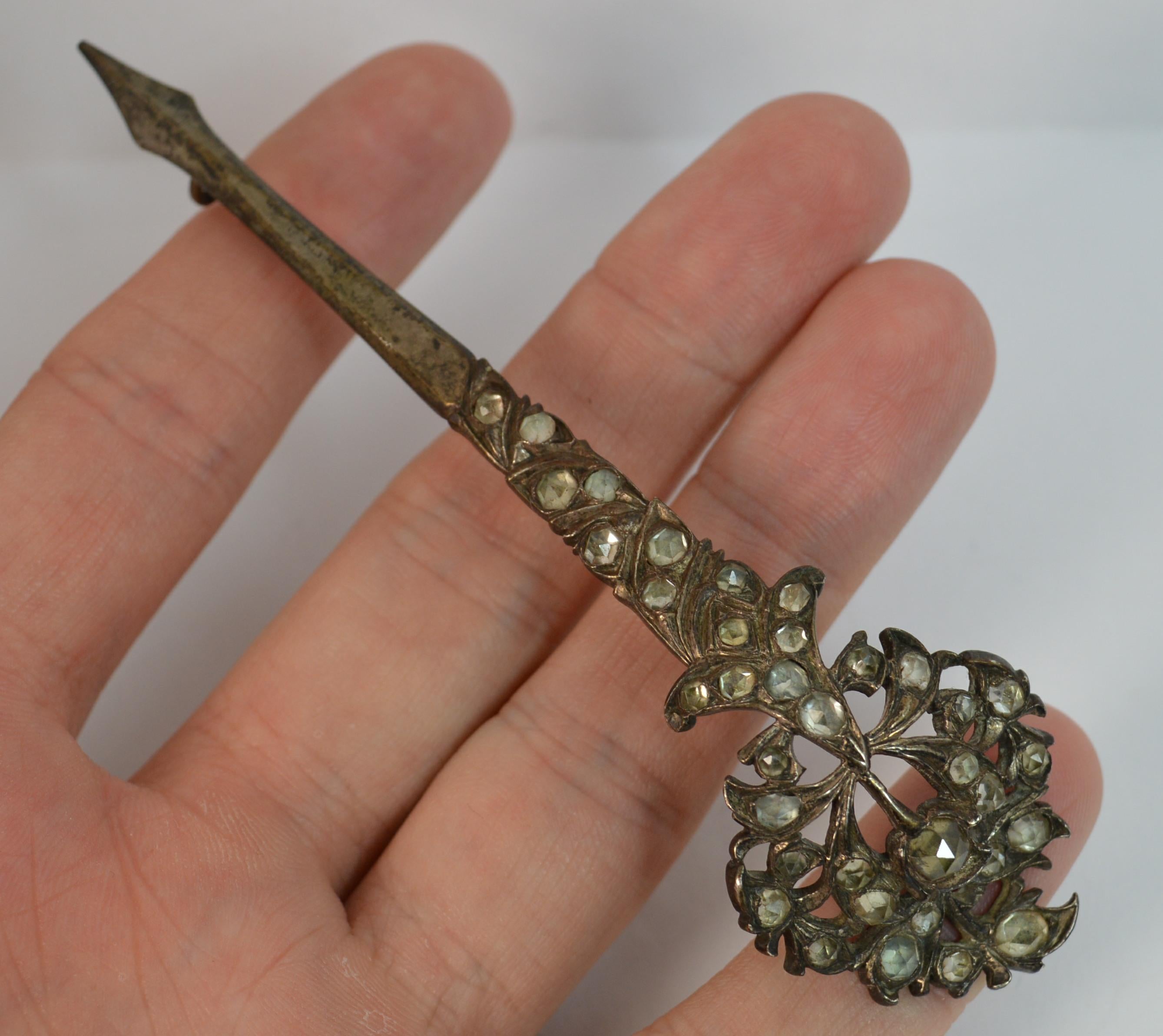 A very early kondakoora brooch. Stylish shape and design. Set with multiple rose cut rock crystal stones. Wonderful design.

Condition ; Very good. Crisp pattern. Issue free. Working pin and hinge. Original stones. Please view