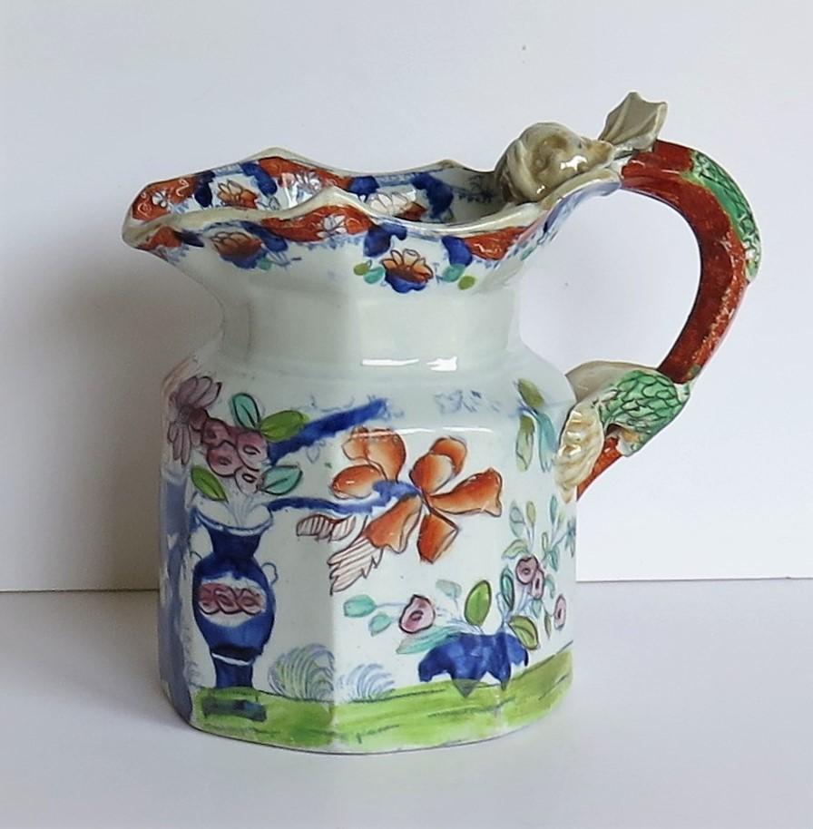 This is a rare, large ironstone pottery jug or pitcher in the Fenton shape made by Mason's Ironstone, of Lane Delph, Staffordshire, England, circa 1815.

The jug is octagonal in section and potted in the rarer Fenton shape with an impressive dragon