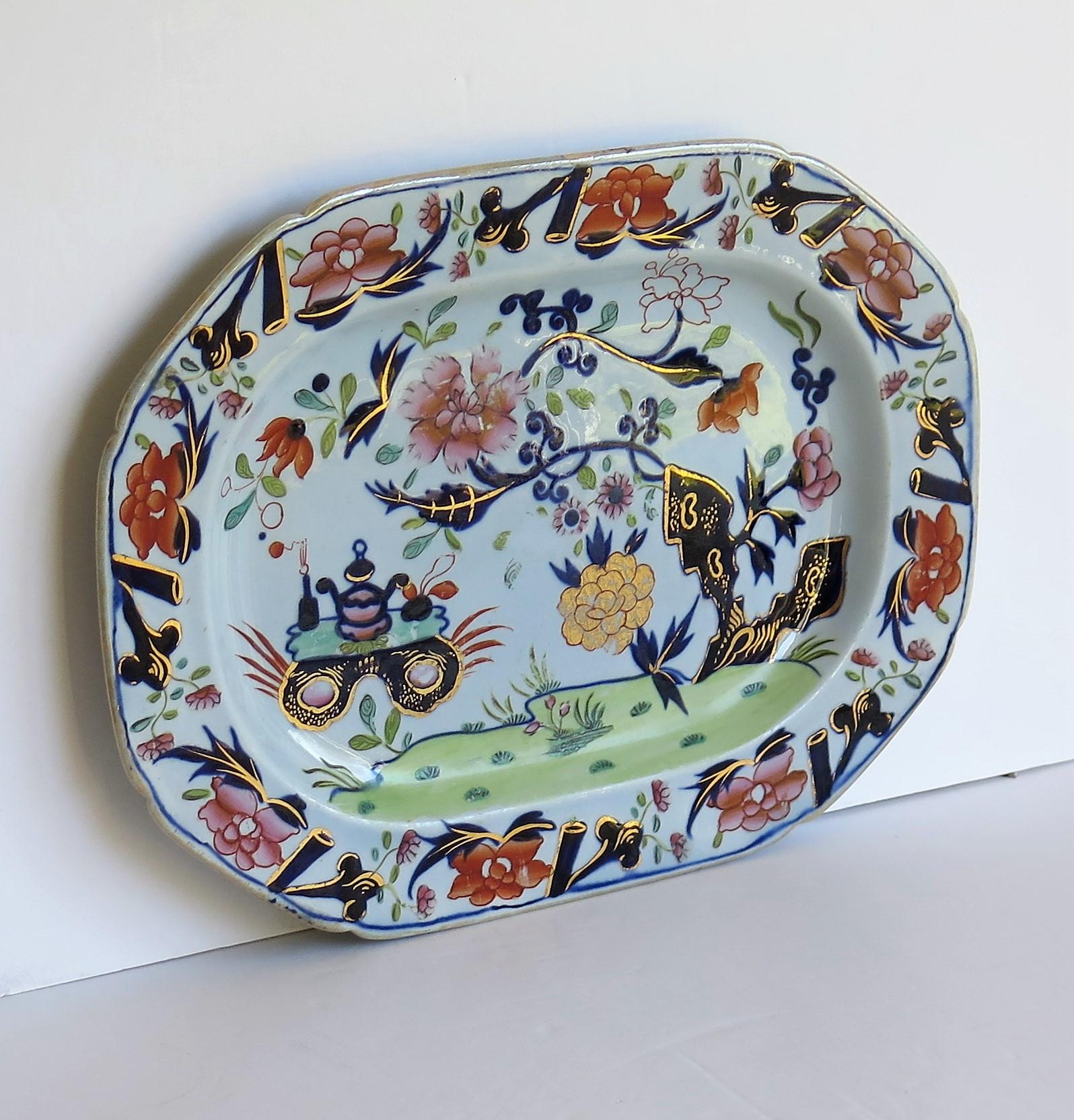 This a fairly large, very early 19th century platter of 12.5 inch width made by Mason's Ironstone in the small vase, flower and rock pattern, circa 1815.

Very early 19th century Mason's Ironstone platters are rare and this is a fine heavy example