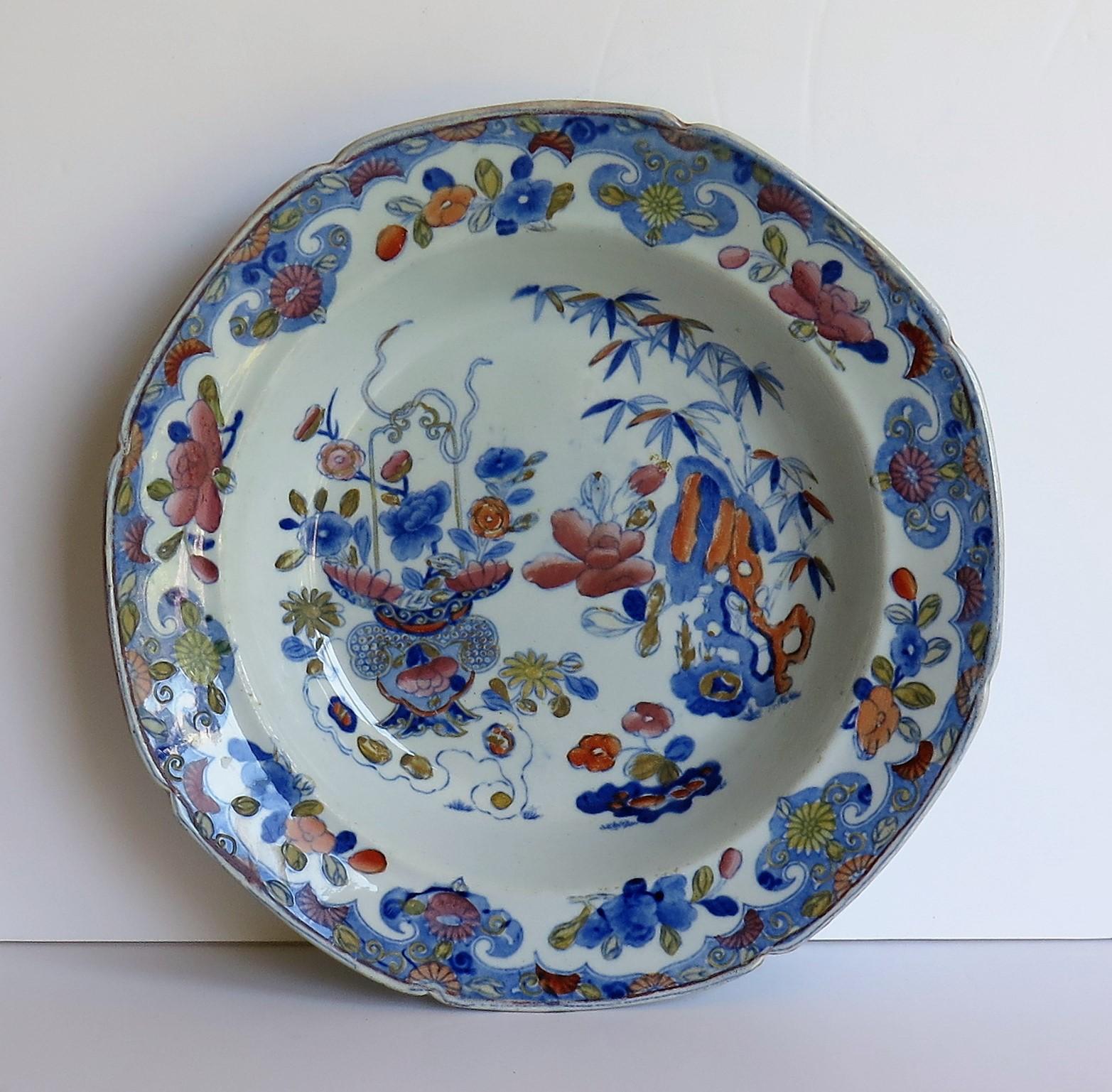 This is a very decorative soup bowl or plate by Mason's Ironstone, Lane Delph, England in the Bamboo and Basket pattern, dating to the very earliest transitional period of Mason's Ironstone, circa 1812.

The bowl is circular in shape with a