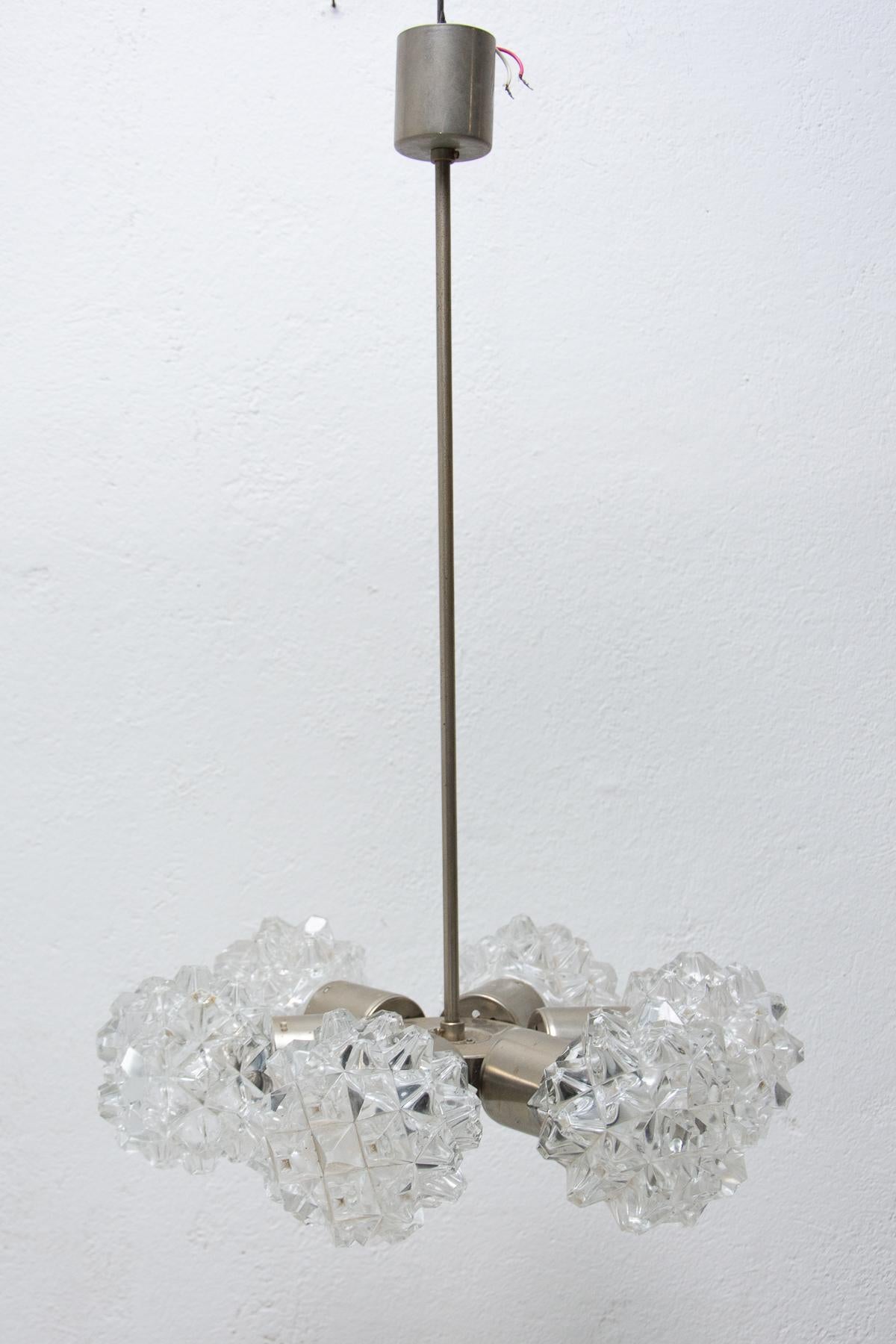 Czechoslovak cut glass and chrome plated ceiling light, made in the former Czechoslovakia for Kamenický Šenov in the 1970´s. It features chrome steel structure and six cut glass lampshades. The pendant is in very good condition. Newly wired.

E27