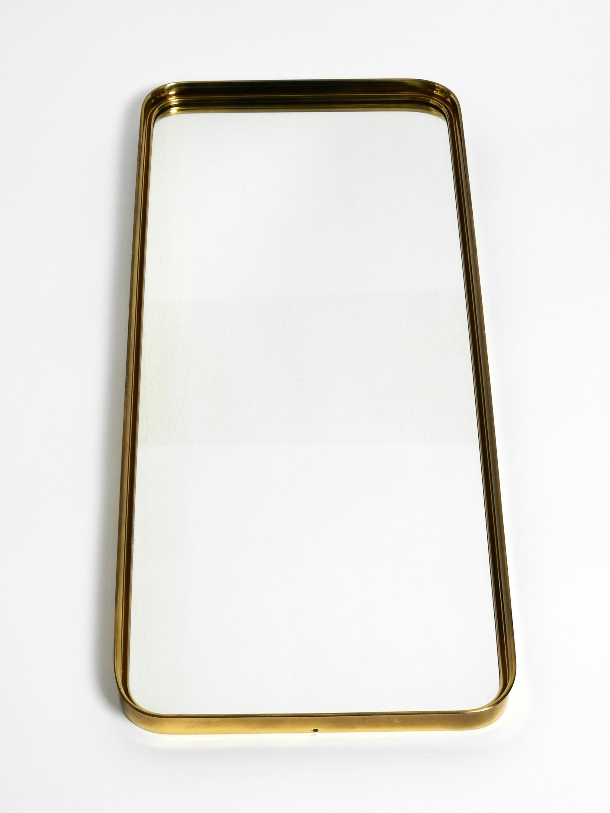 Very Elegant Minimalist Mid Century Brass Wall Mirror by Vereinigte Werkstätten For Sale 4