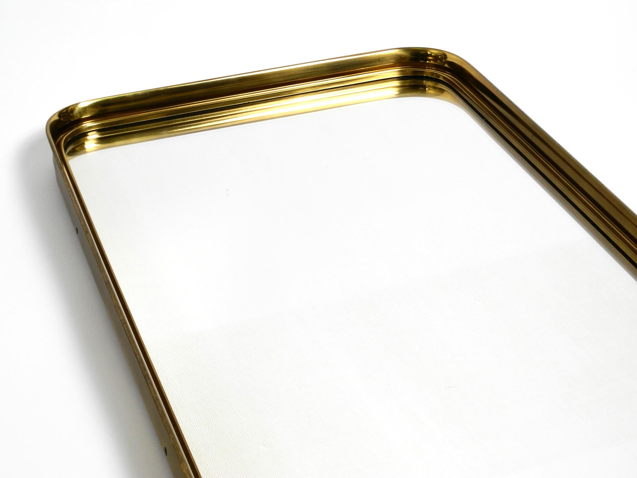 Very Elegant Minimalist Mid Century Brass Wall Mirror by Vereinigte Werkstätten For Sale 9