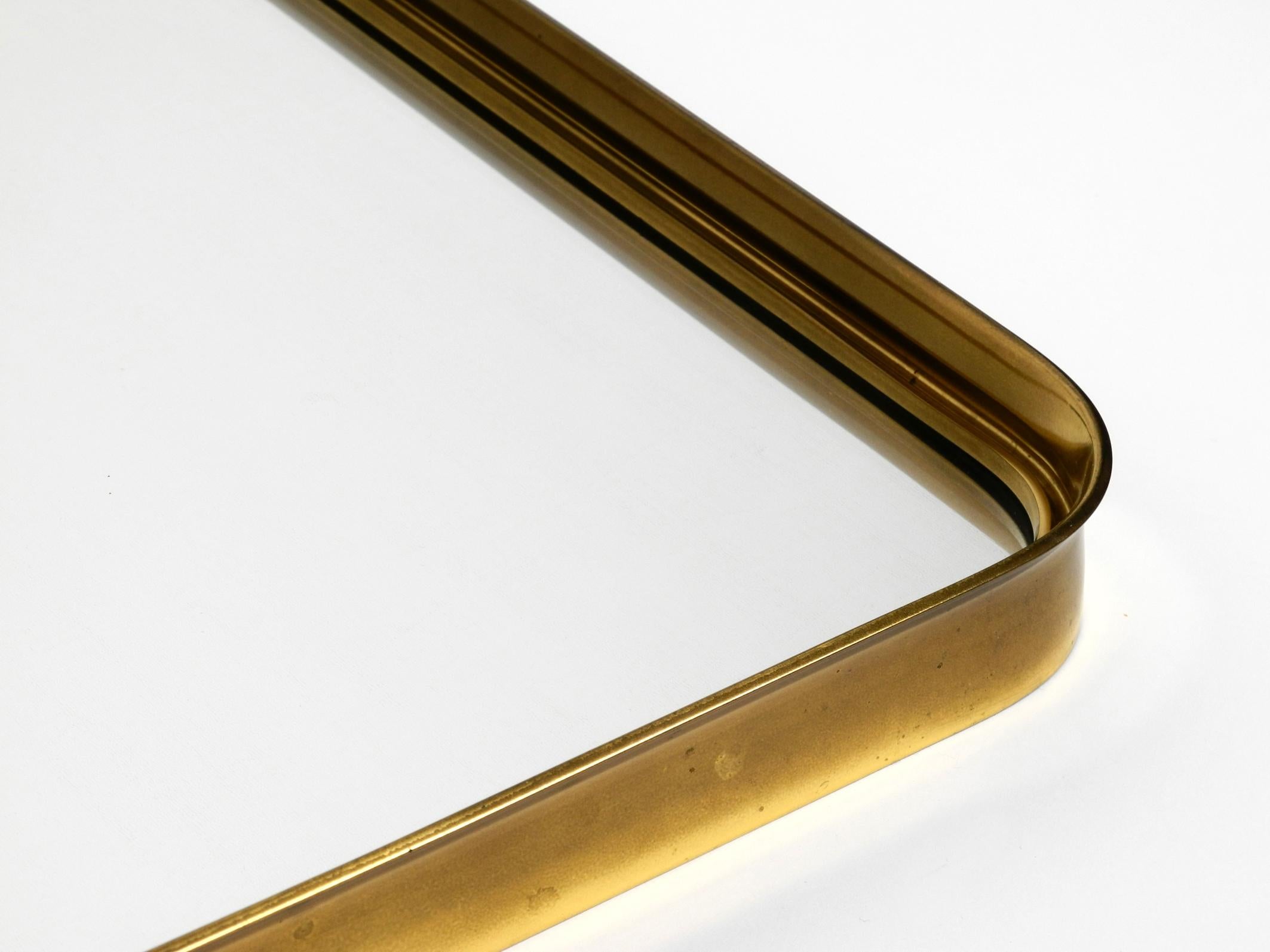 Very Elegant Minimalist Mid Century Brass Wall Mirror by Vereinigte Werkstätten For Sale 12