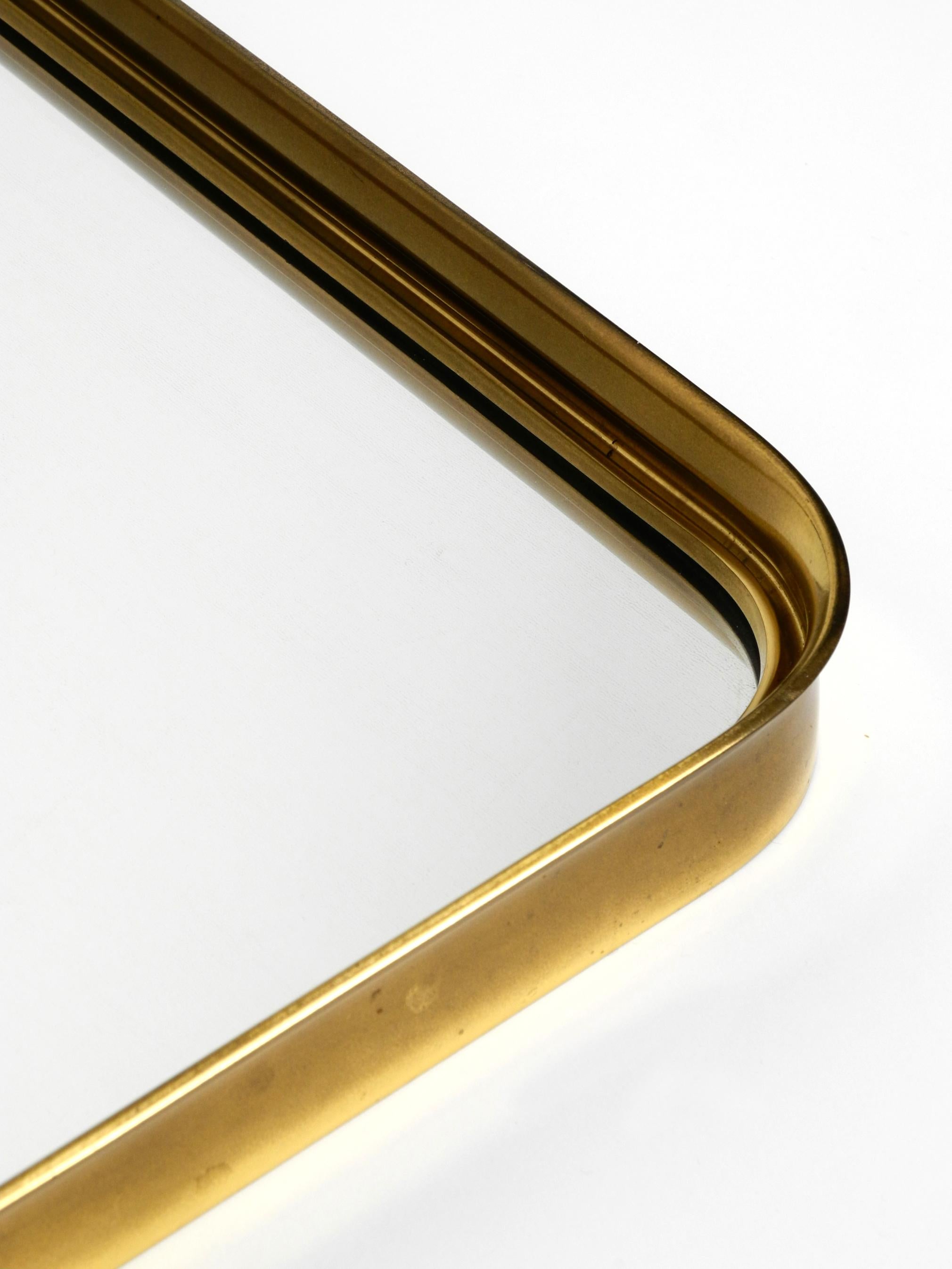 Mid-20th Century Very Elegant Minimalist Mid Century Brass Wall Mirror by Vereinigte Werkstätten For Sale