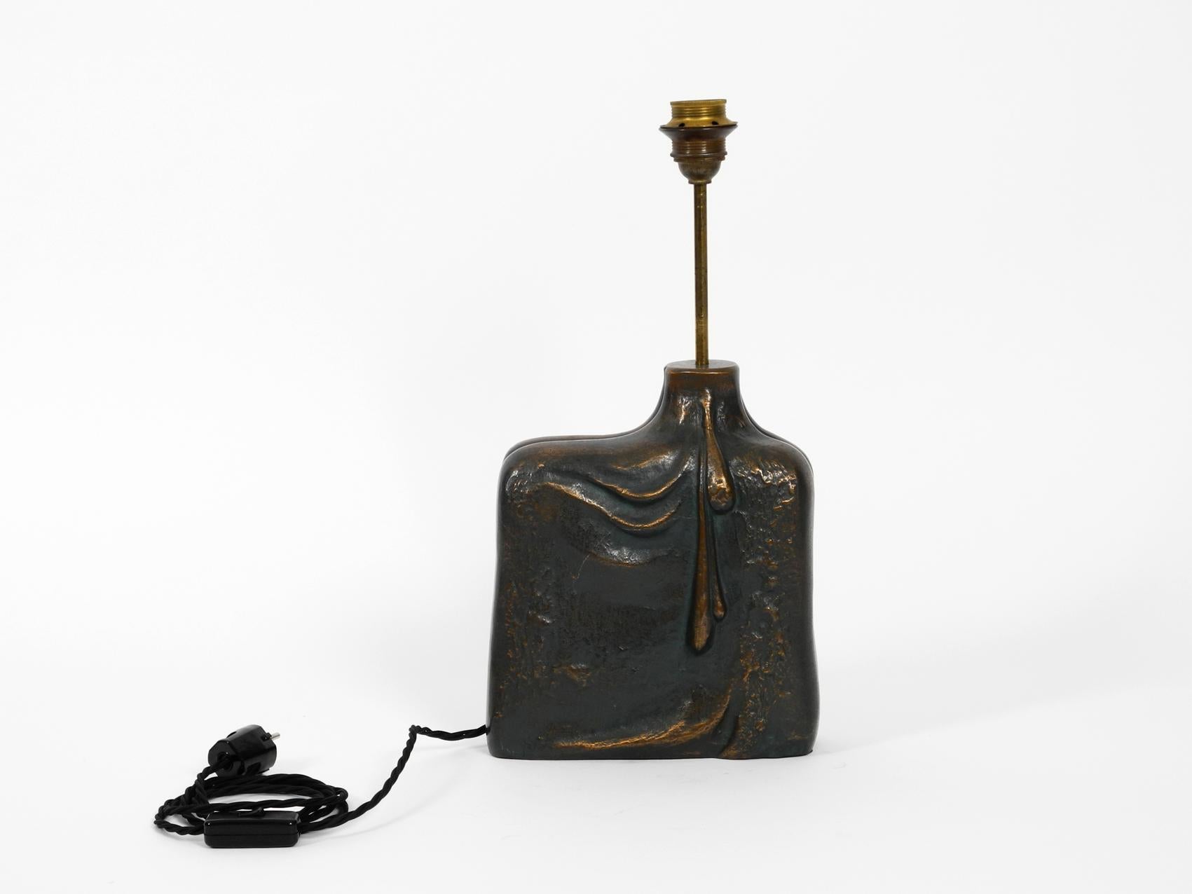 Very elegant table lamp from the 1960s made of bronze. Beautiful very noble organic design with a female figure on the front and water droplets on the back. Lamp base is made entirely of heavy bronze. Weight about 7 kg, although it is hollow