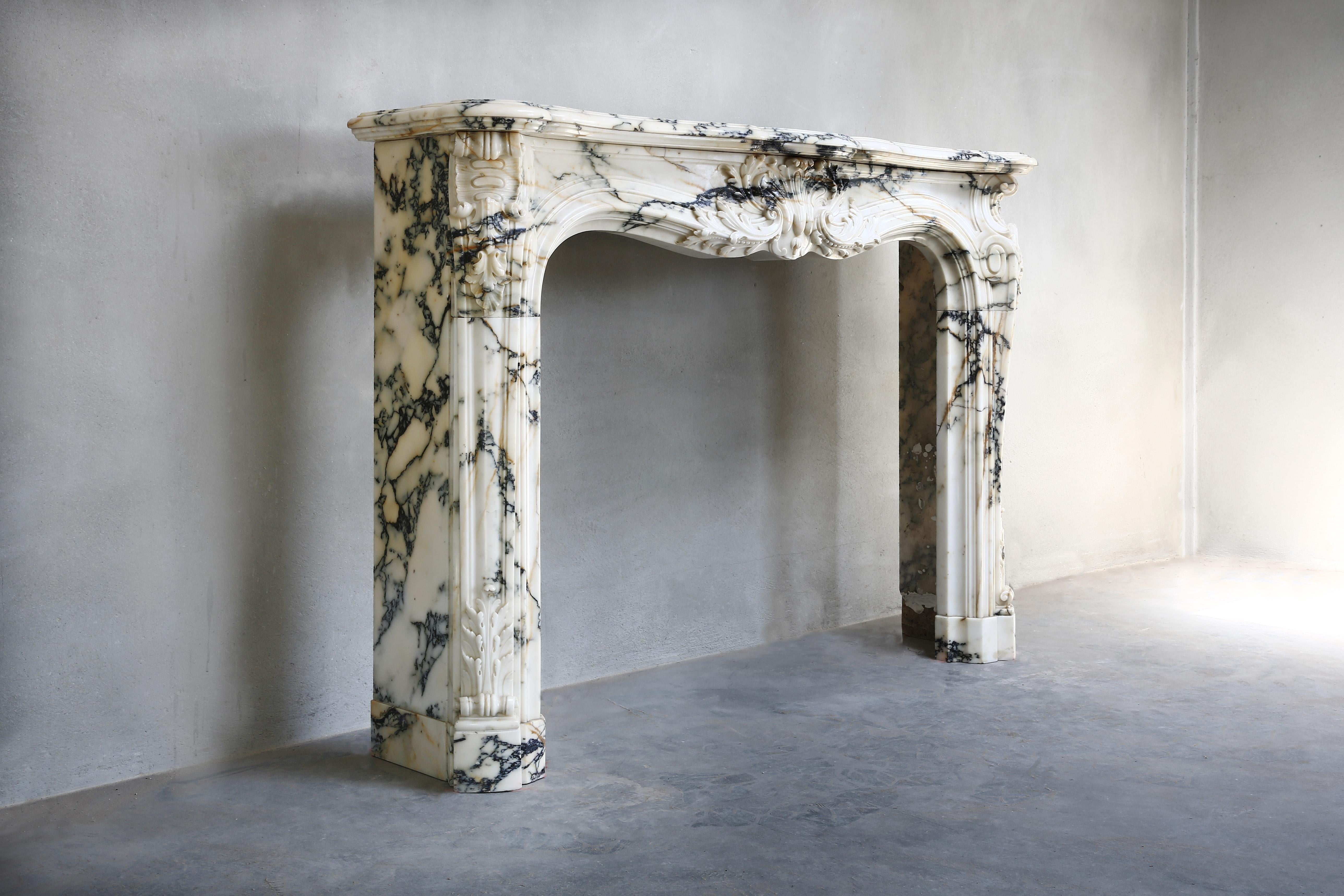 Very exclusive antique marble fireplace from the year 1820!  The marble type of this beautiful fireplace is Paonazzo marble from Tuscany. The characteristics of Paonazzo marble are the diversity of color and composition. The high dose of iron oxide