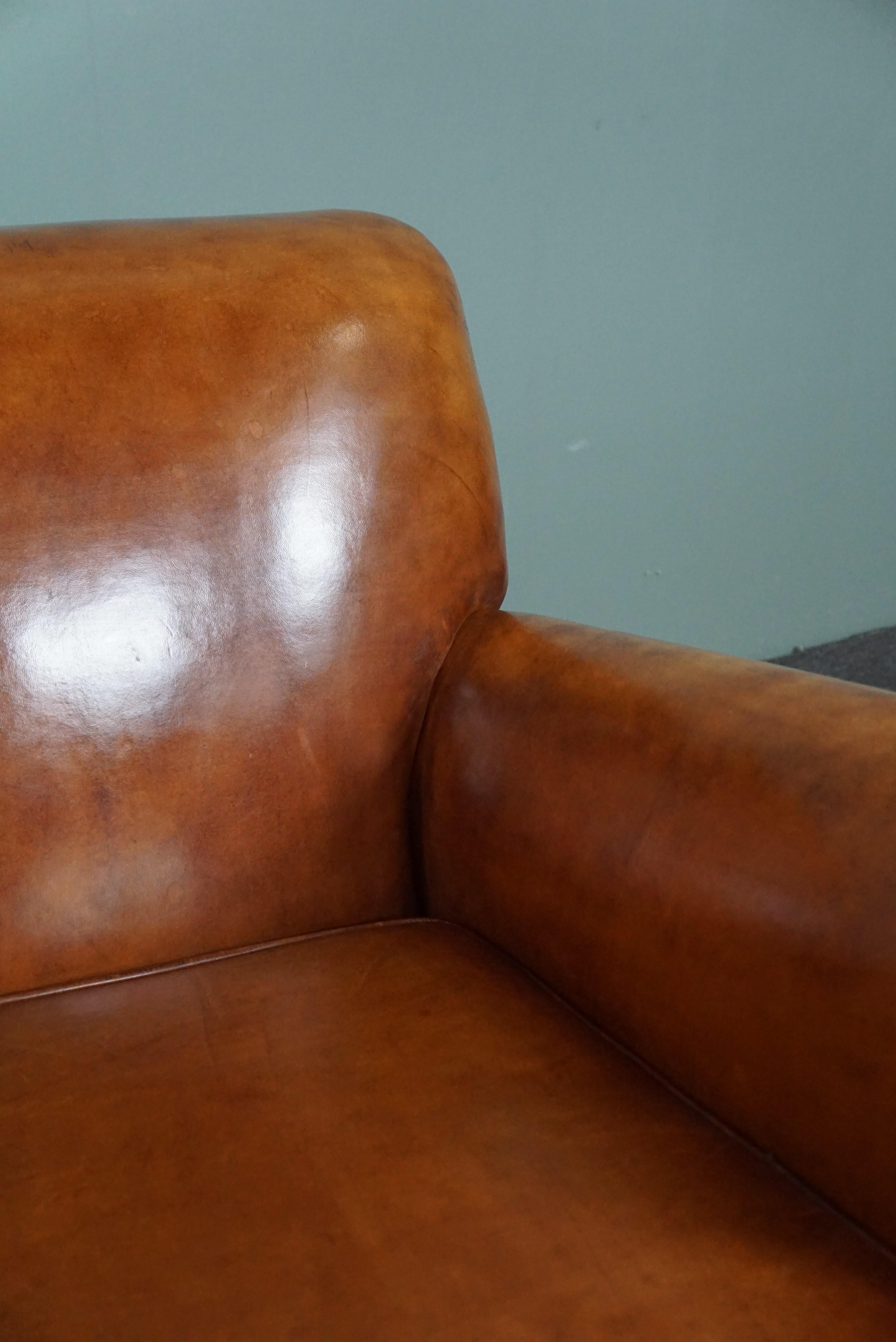 Leather Very exclusive newly upholstered old sheep leather armchair For Sale