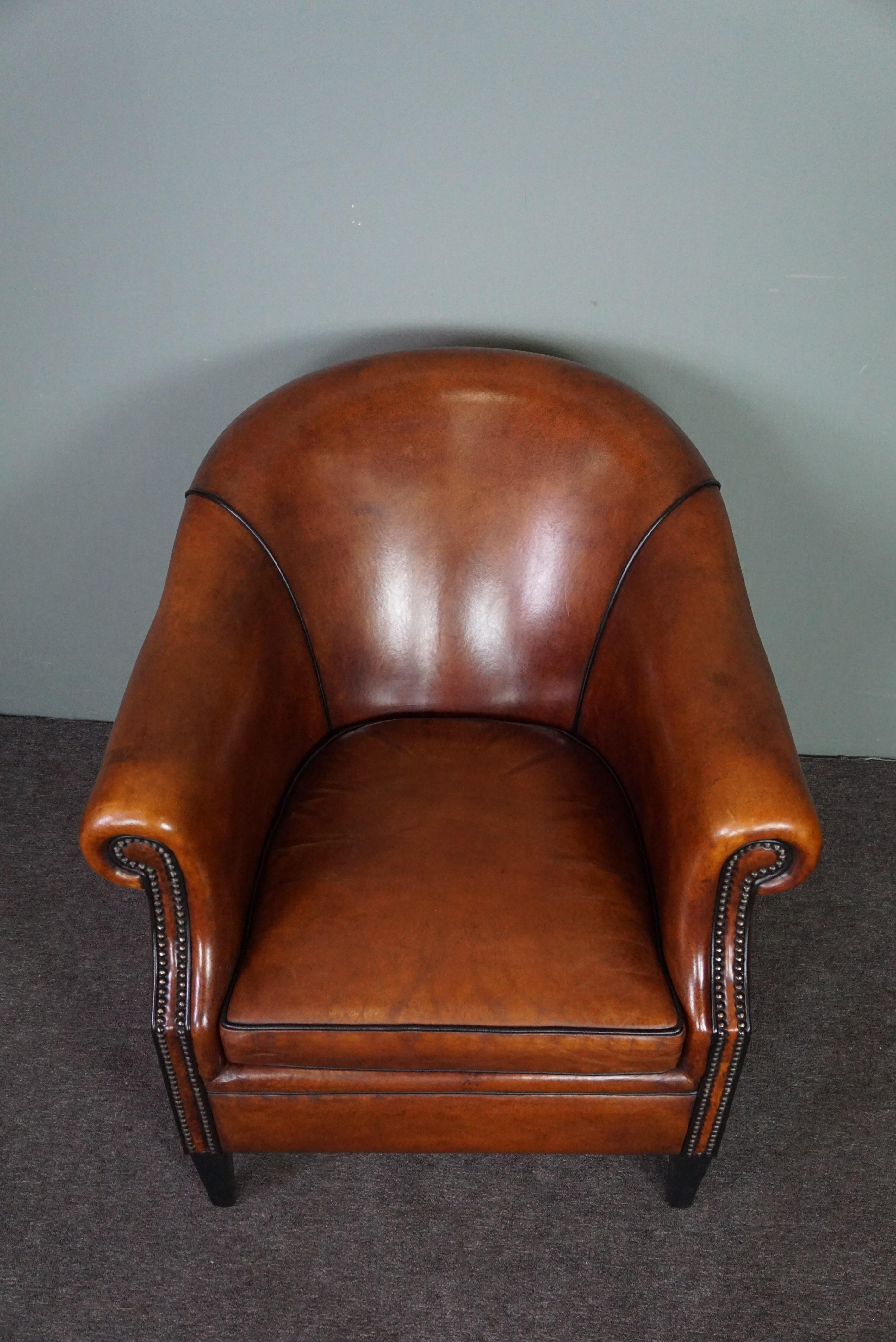 Hand-Crafted Very expressive sheep leather club chair with black piping For Sale
