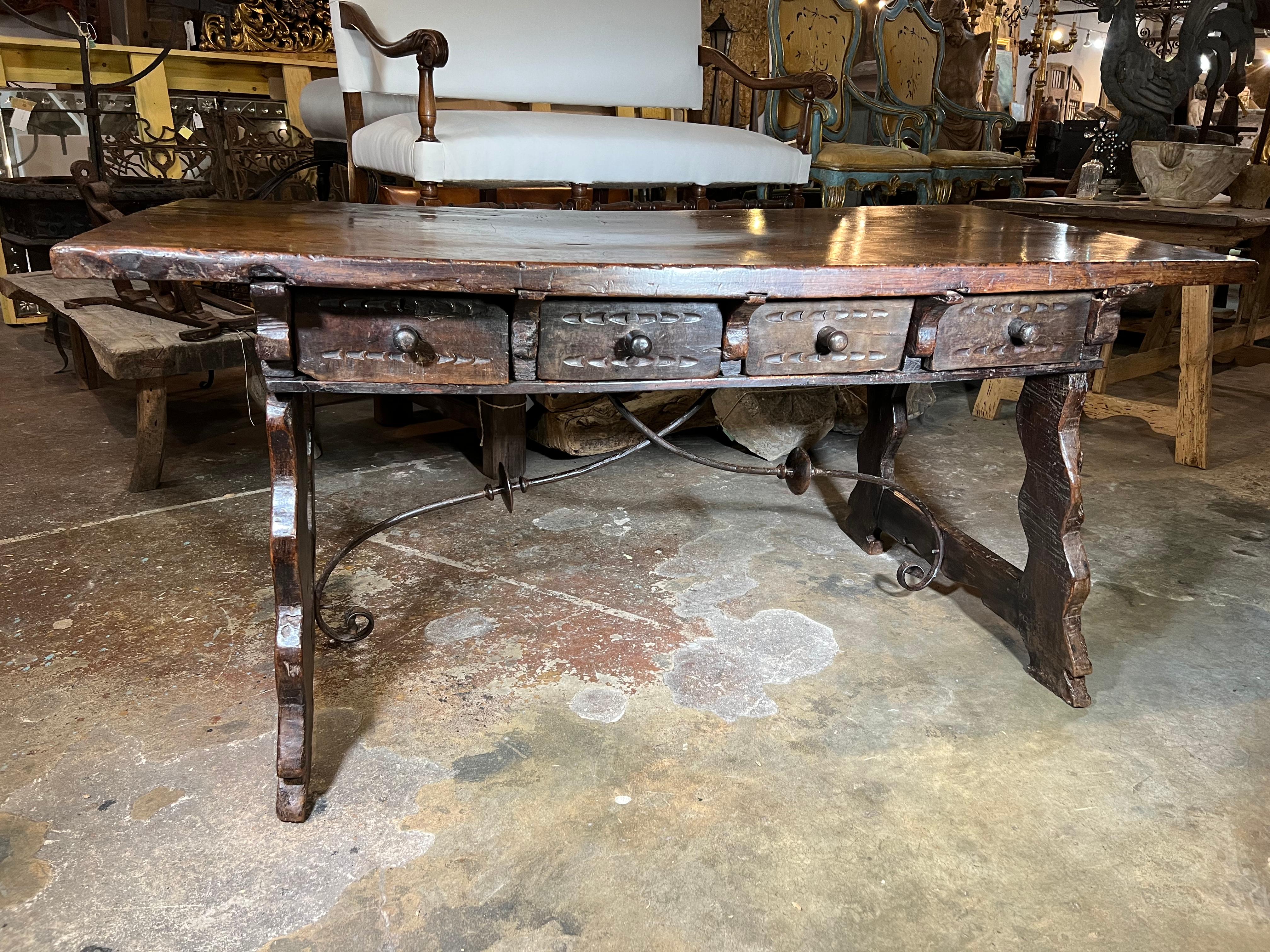 A very fine mid-18th century desk from the Catalan region of Spain. This wonderful desk is beautifully constructed from walnut and hand-forged iron stretchers. The plateau is a solid board - wonderful patina - very rich and luminous. A terrific