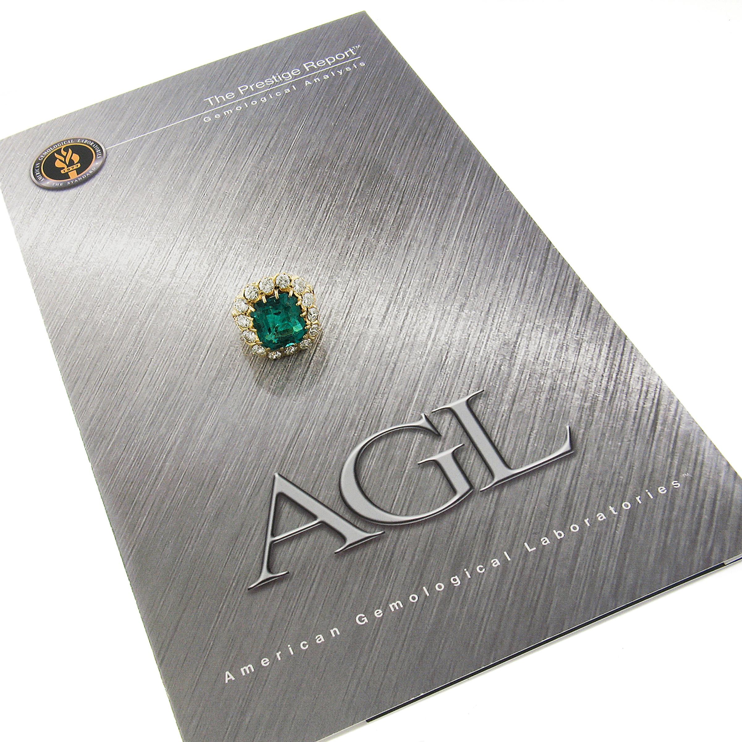 We're very excited to offer this dramatic emerald and diamond cocktail statement ring crafted in solid 18k gold, featuring a large, emerald cut, genuine emerald stone at the center of the ring and is AGL certified as being 100% natural mined stone