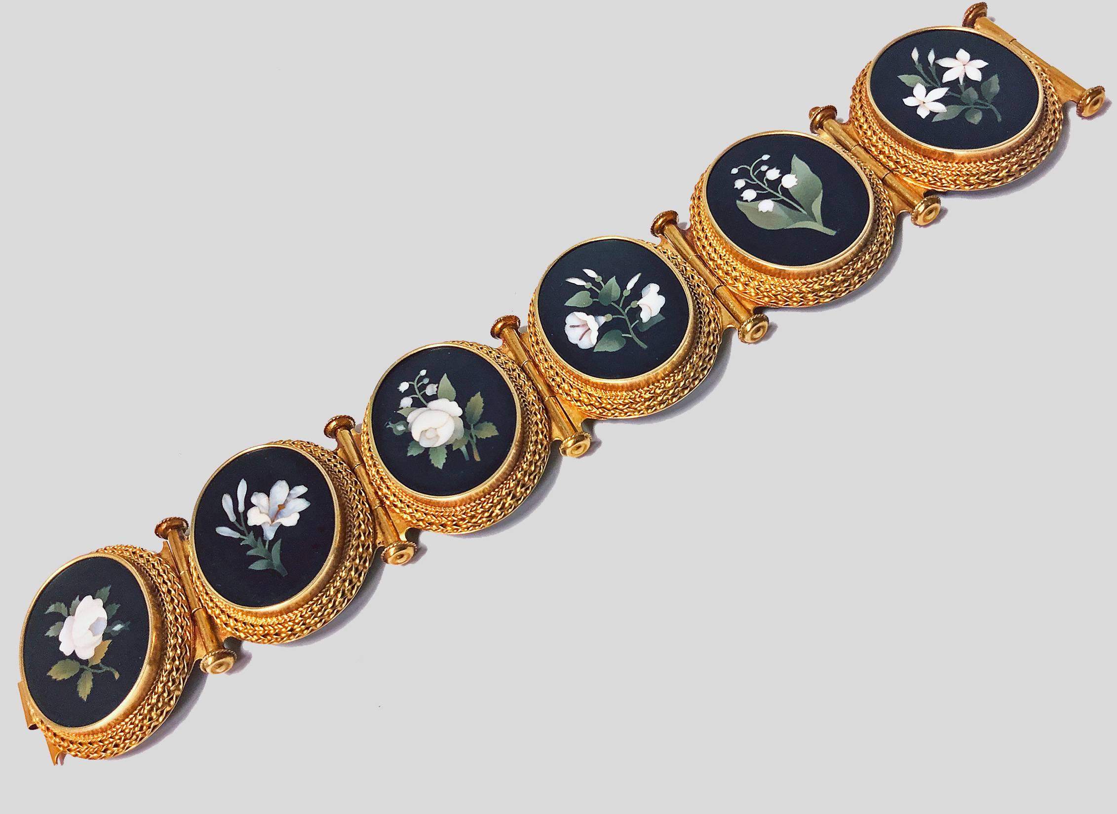 Very fine 19th century 18-karat (tested) gold Pietra Dura bracelet, Italy, circa1875. The bracelet with six oval etruscan granular gold set Pietra Dura depicting foliage, detachable hinged gold links between, terminating with link conforming as
