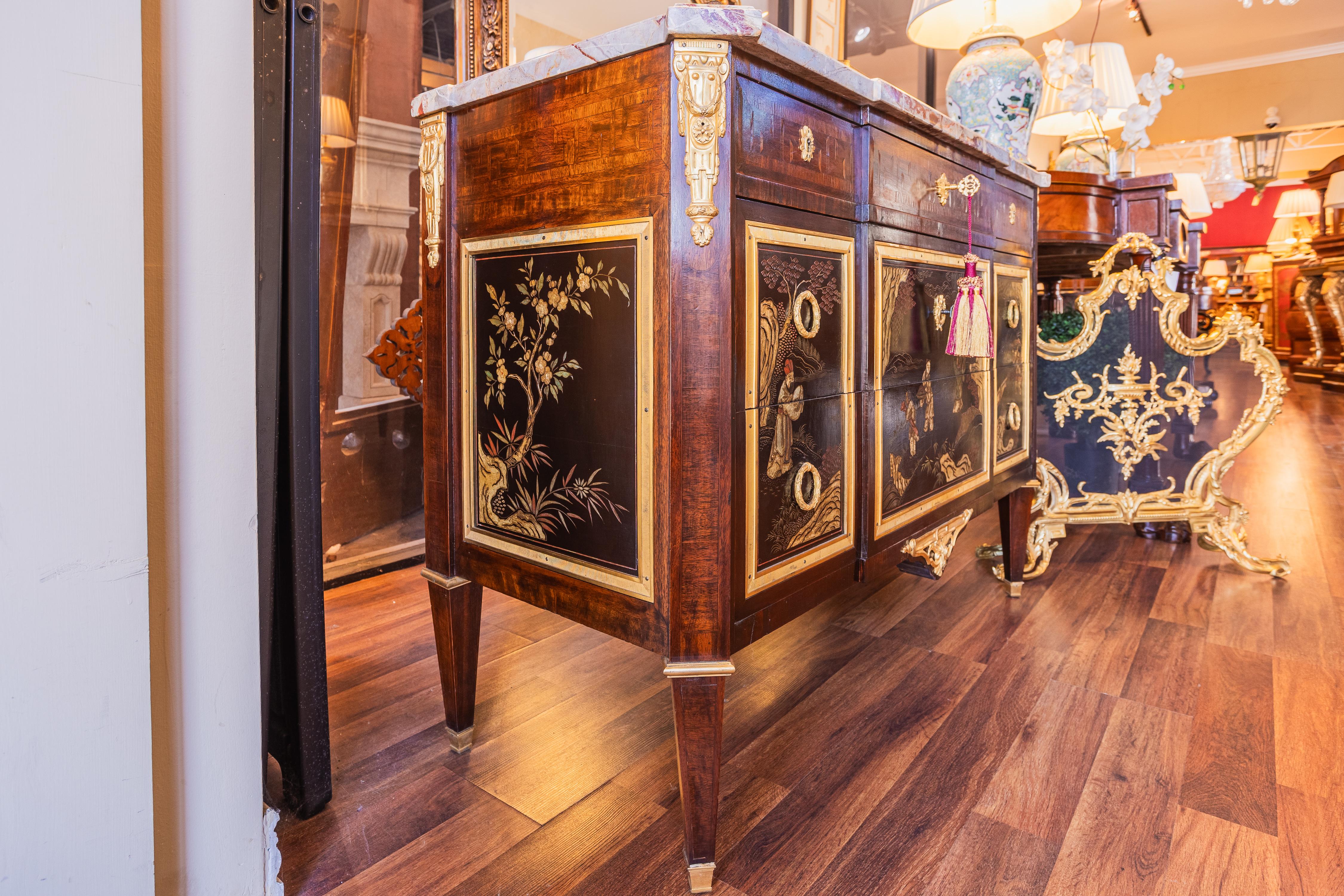 A very fine 19th century French Louis XVI style commode. Beautiful coromandel panels with fire gilt bronze mounts and mahogany body Original marble top.  