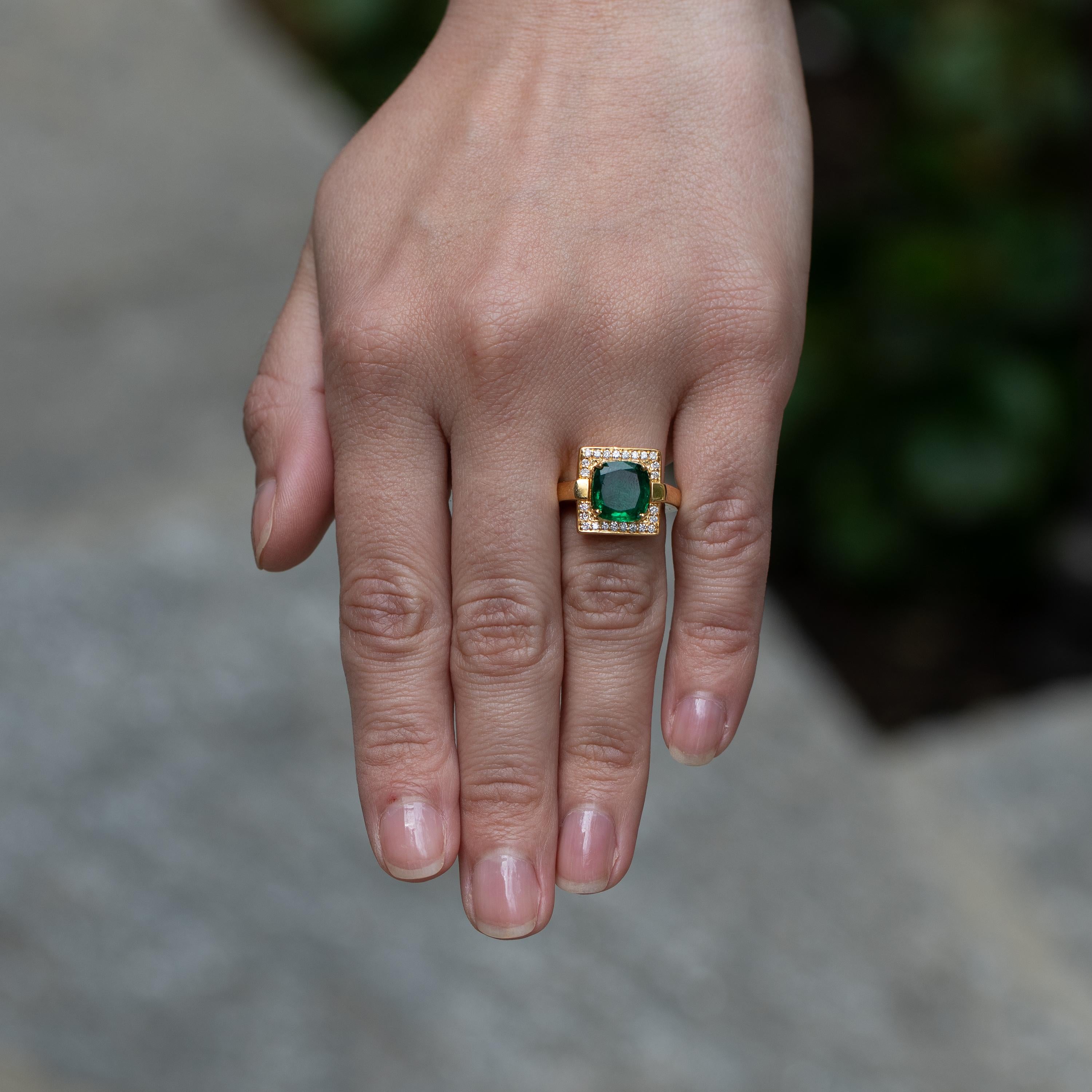 This Beautiful Setting Wonderfully Encases This Stunning Emerald, Really Showing Off Just How Amazing It Is. 
Vert Fine Emerald = 2.91 carats
Diamonds = 0.24 carats
( Color: F, Clarity: VS )
18K Yellow Gold
Ring Size = 3.5
Complimentary Ring Sizing