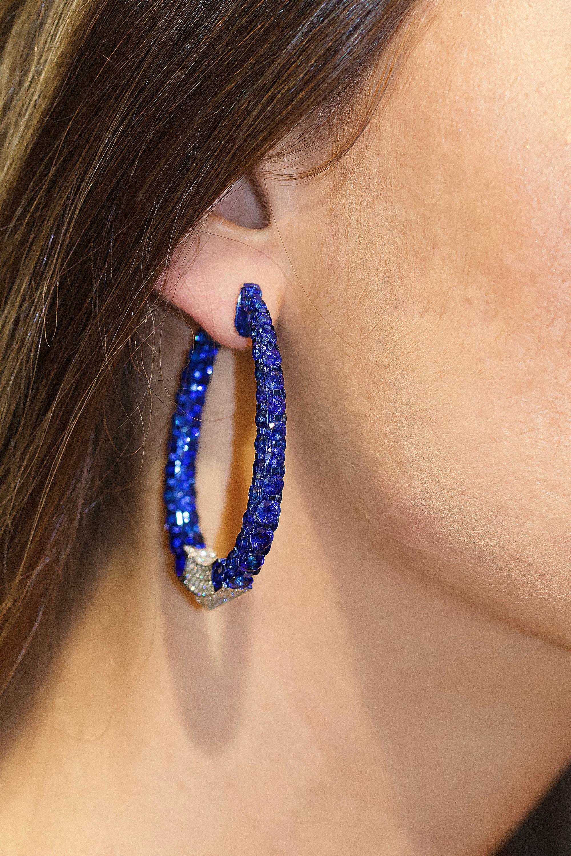 Beautiful Diamond Hoops, These earring are from an New York estate. The craftsman ship is exceptional. The 18k gold metal has a blue rhodium finish on it as well, so all you see is blue, blue, blue. It is so LUX and cool. The earrings have over 38