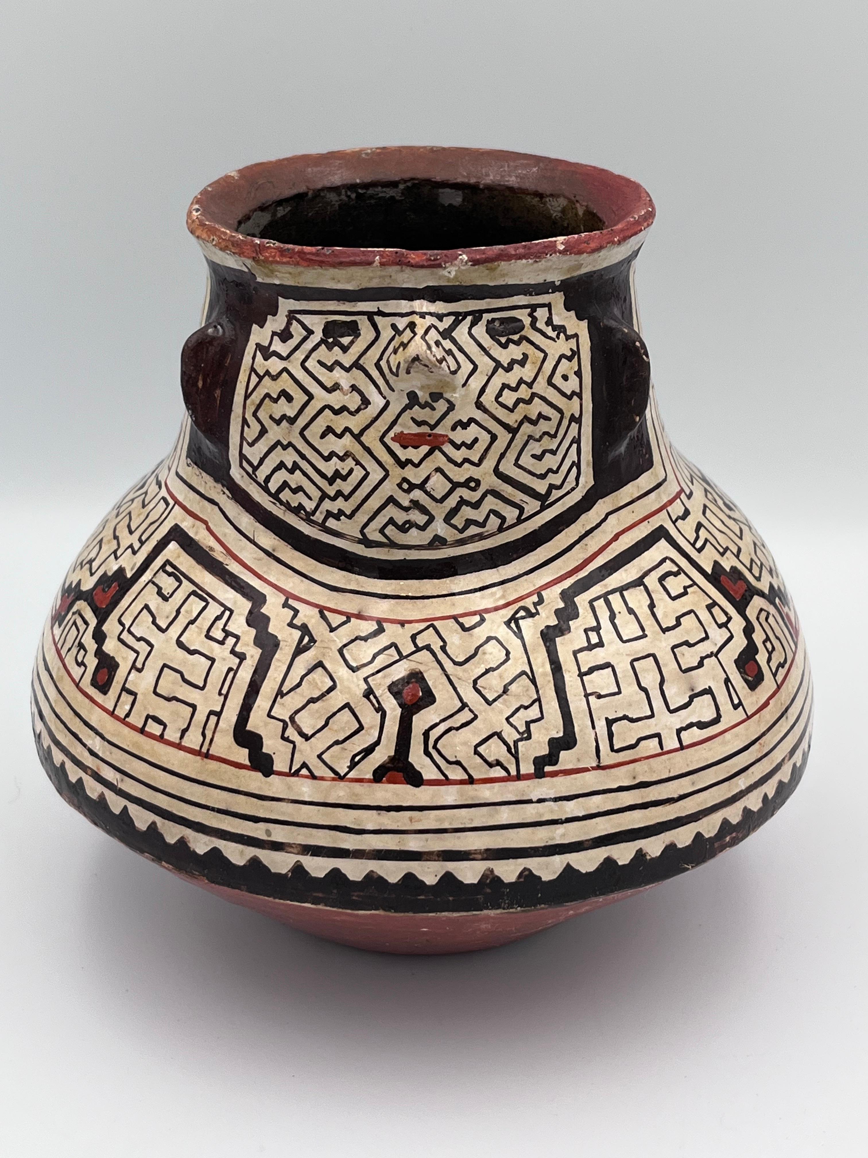 Very Fine Detailed Figural Peruvian Shipibo-Conibo Pottery Effigy Pot or Vase

This beautifully detailed figural pottery effigy pot was crafted by the Shipibo-Conibo people of Peru, known for their highly distinctive geometric designs and rich