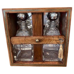 Very Fine English Burl Walnut Tantalus with Two Cut Glass Decanters