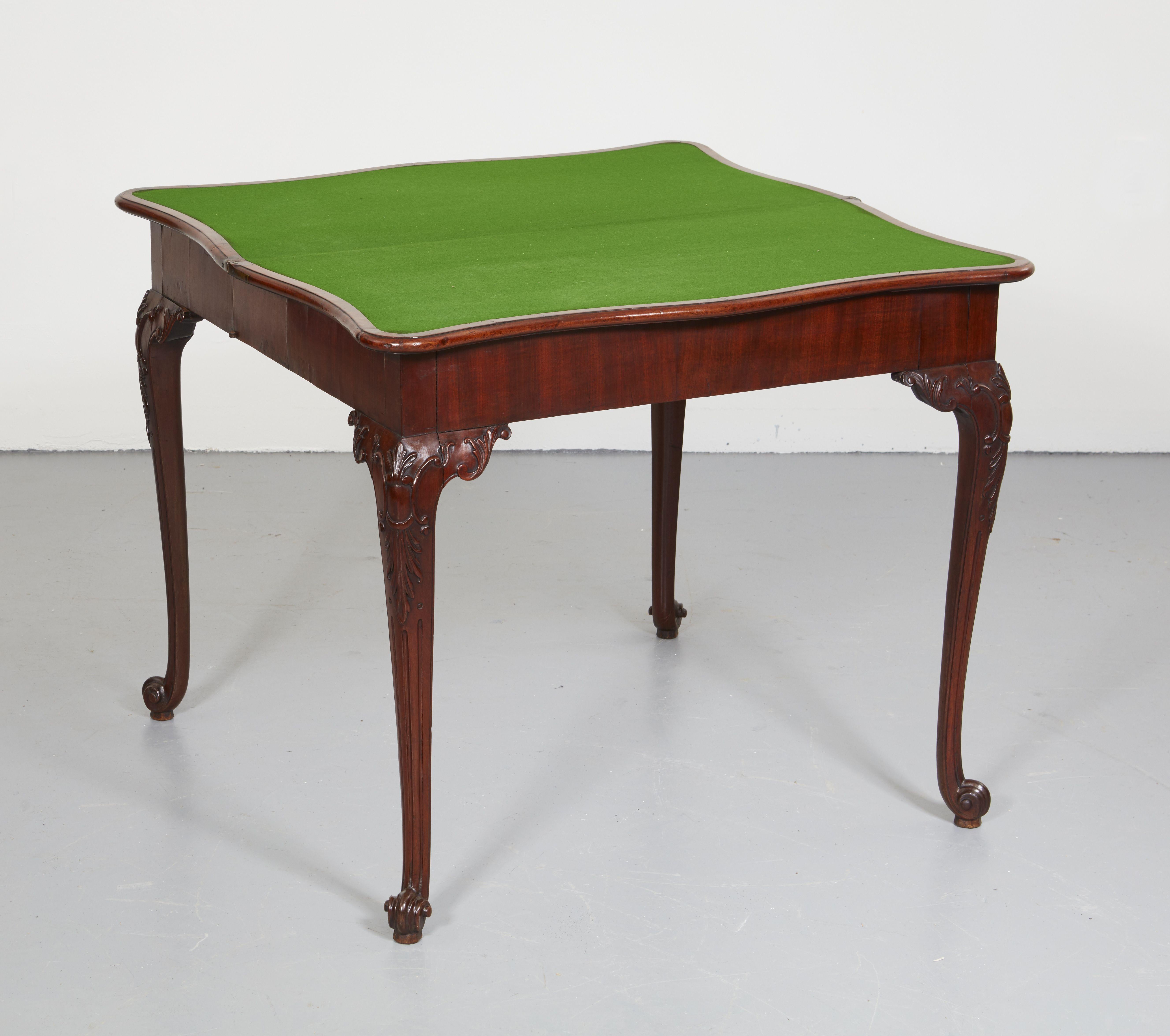 Very fine Georgian mahogany card table possibly by Paul Saunders, with shaped and molded serpentine top with baize lined interior and concertina action, the accordian sides with fine hinges stamped 