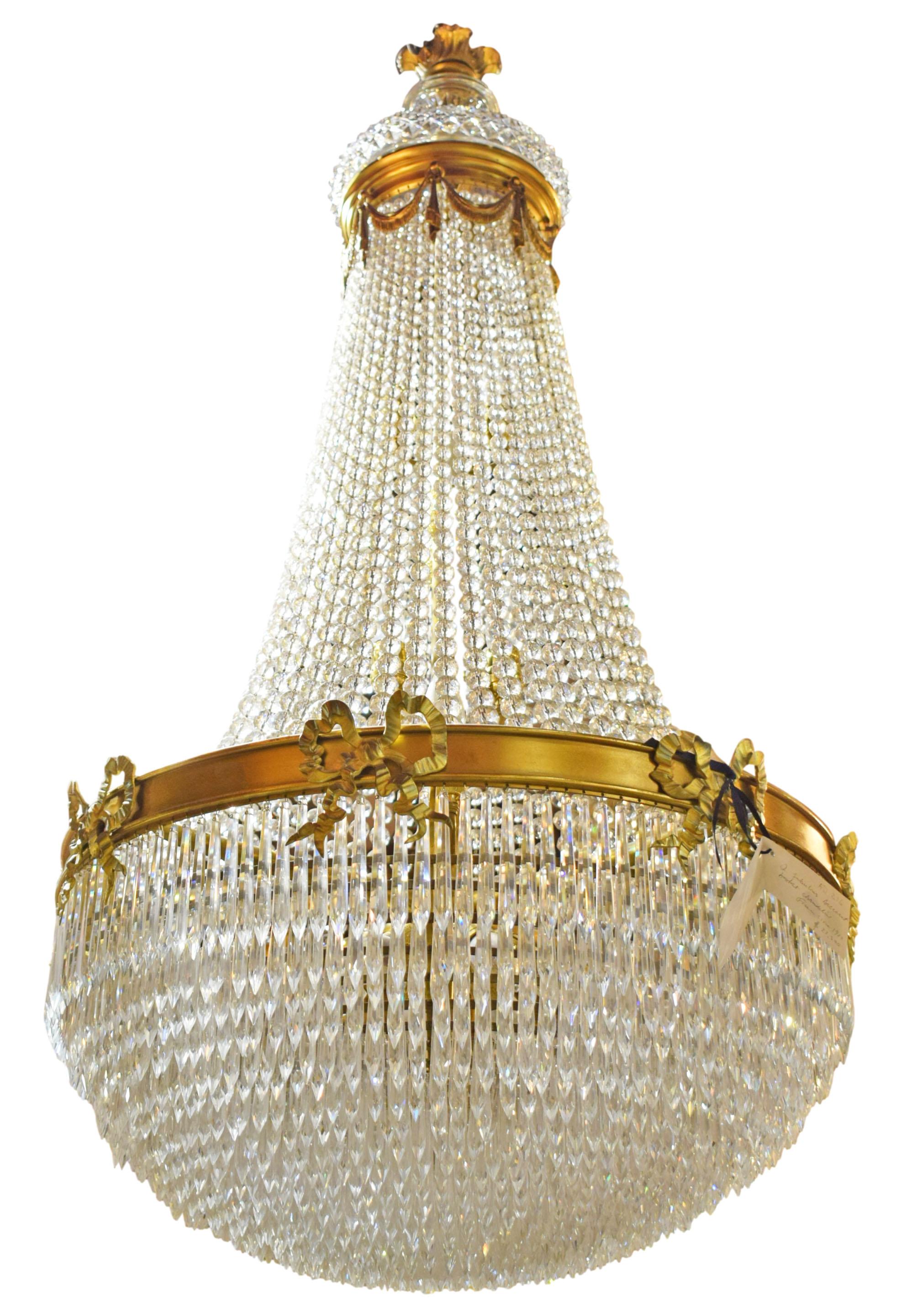 Very fine gilt bronze and crystal basket style chandelier by Baccarat, France circa 1900.  14 Lights.
Dimensions: Height 50