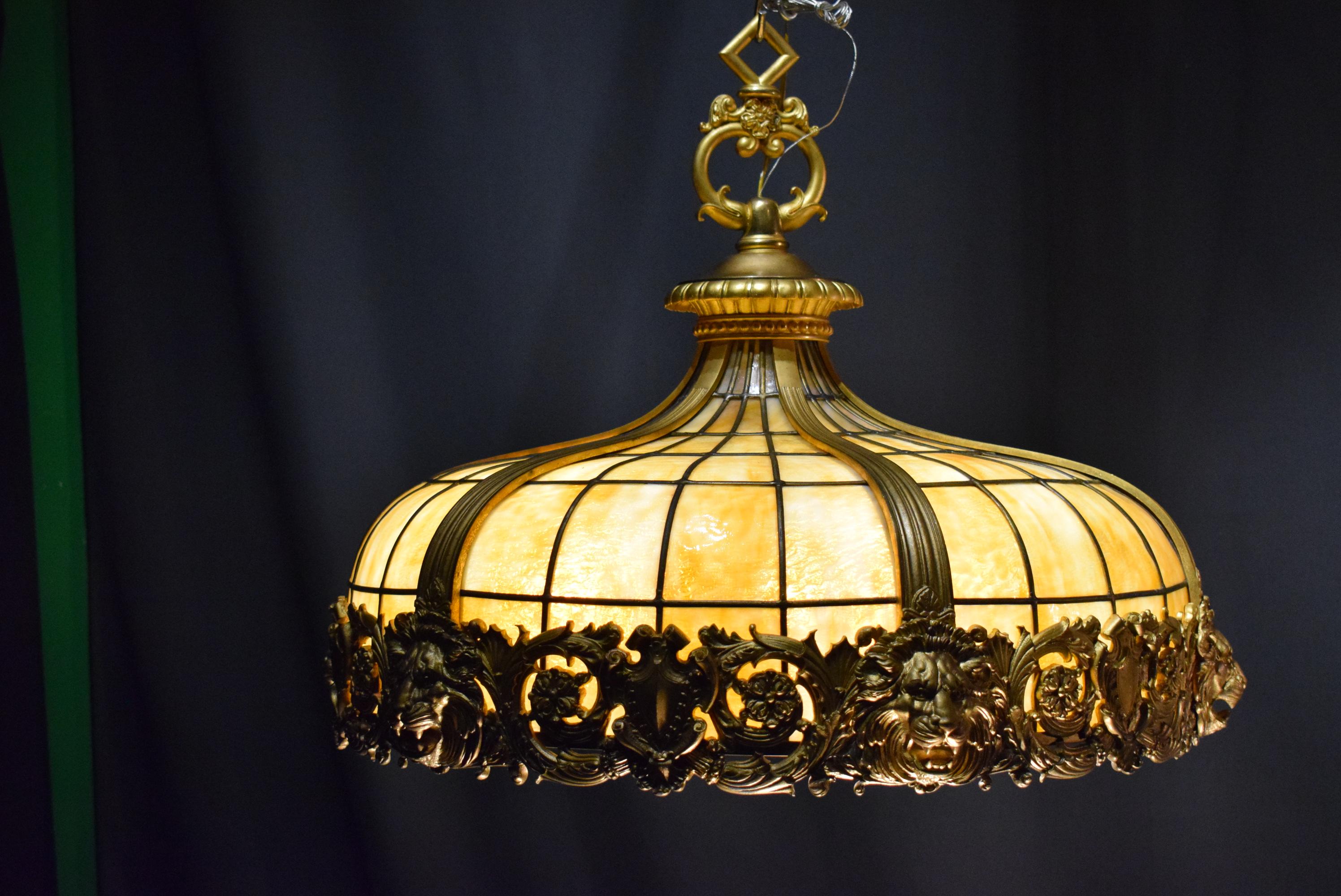 Very fine gilt bronze and slag glass hanging lamp attributed to Duffner and Kimberly. This firm made these types of lamps for a very short period in the early 1900s. Eight internal lights. Duffner and Kimberly was a New York City company which