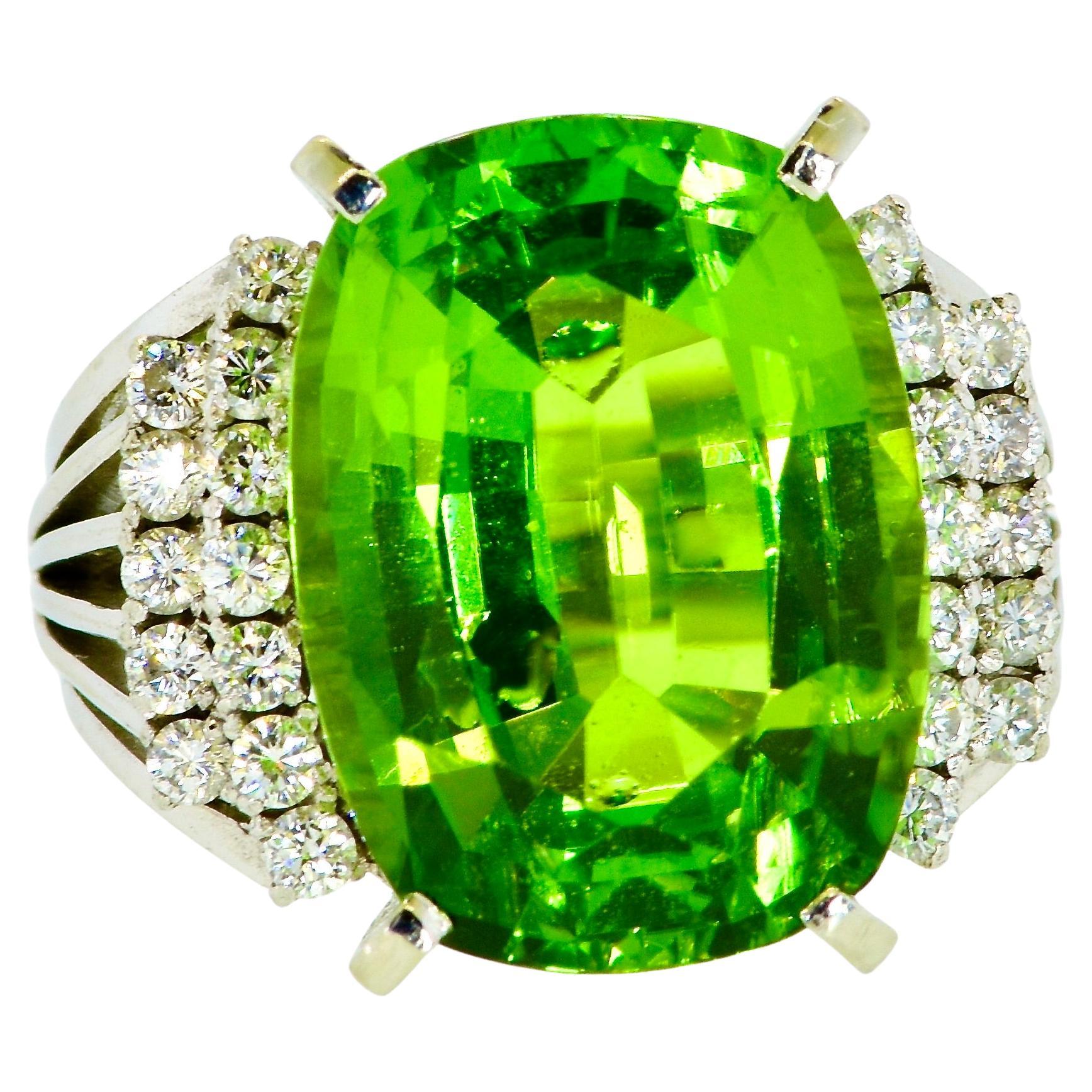 Very fine large, 11.93 cts natural bright green cushion cut Peridot with high clarity.  This is a very fine specimen; the fine color is a bright lime uniform color with very strong reflections off the back, pavillion, facets and the stone has high
