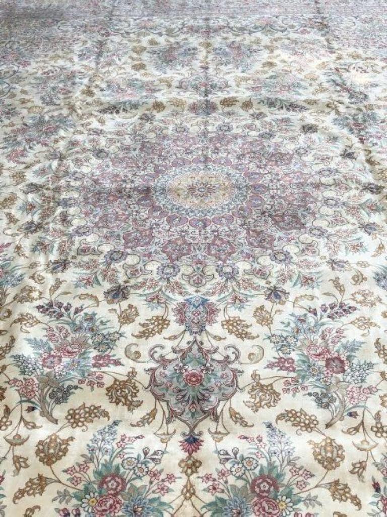 Magnificent Persian pure silk Qum with silk foundation. This rug has approximately 700 knots per sq inch with a total of 16,000,000 knots tied by hand one by one. It took 9 years to complete this beautiful piece of art. It is signed by Mahloojie.