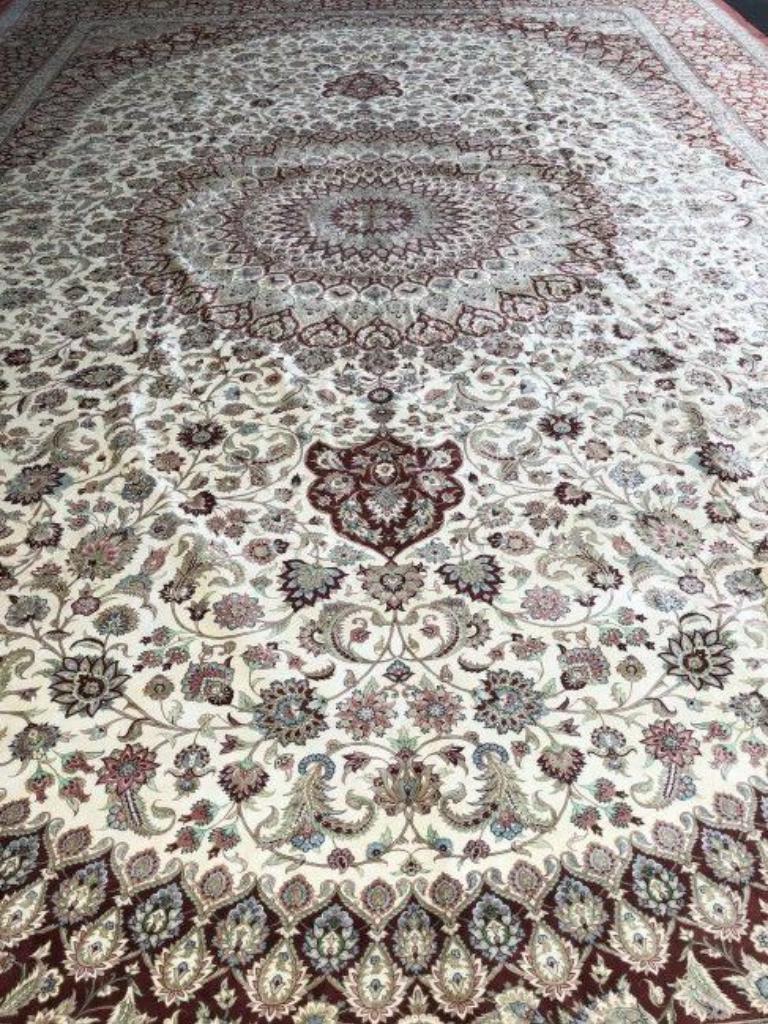 This is a magnificent pure silk Qum rug. 700 Knots per inch, Size 14.7 x 21.4 Iran Qum Silk and Silk foundation. Around 31,000,000 knots tied by hand one by one. It takes 14 years to complete this piece of art. The signature reads: woven in Iran,