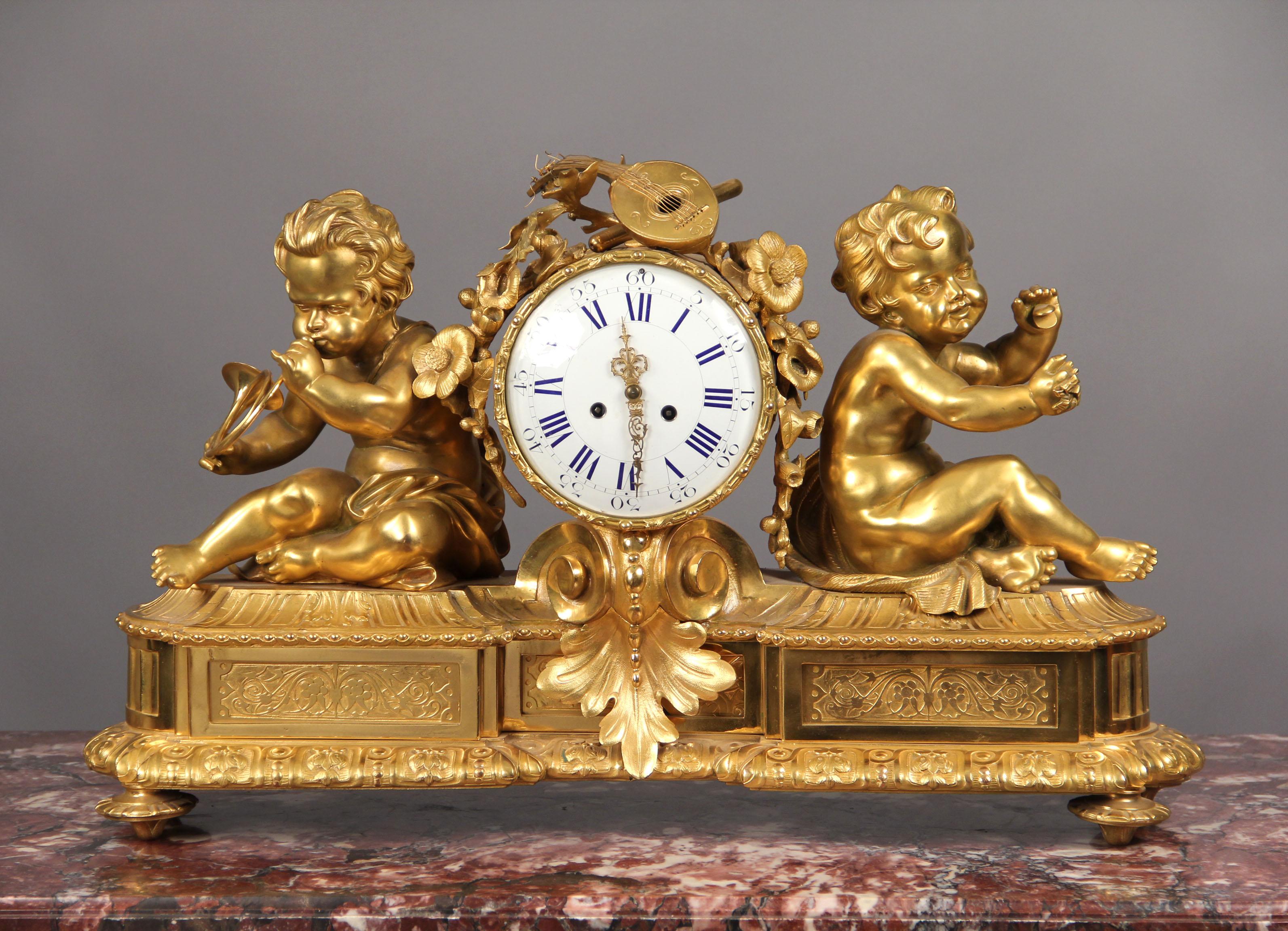A Very Fine Late 19th Century Gilt Bronze Mantle Clock


The clock face is flanked by one child playing the french horn,the other playing with finger cymbals, all raised on an elaborate bronze base.

Details:
Height – 18 inches / 46cm
Width – 28