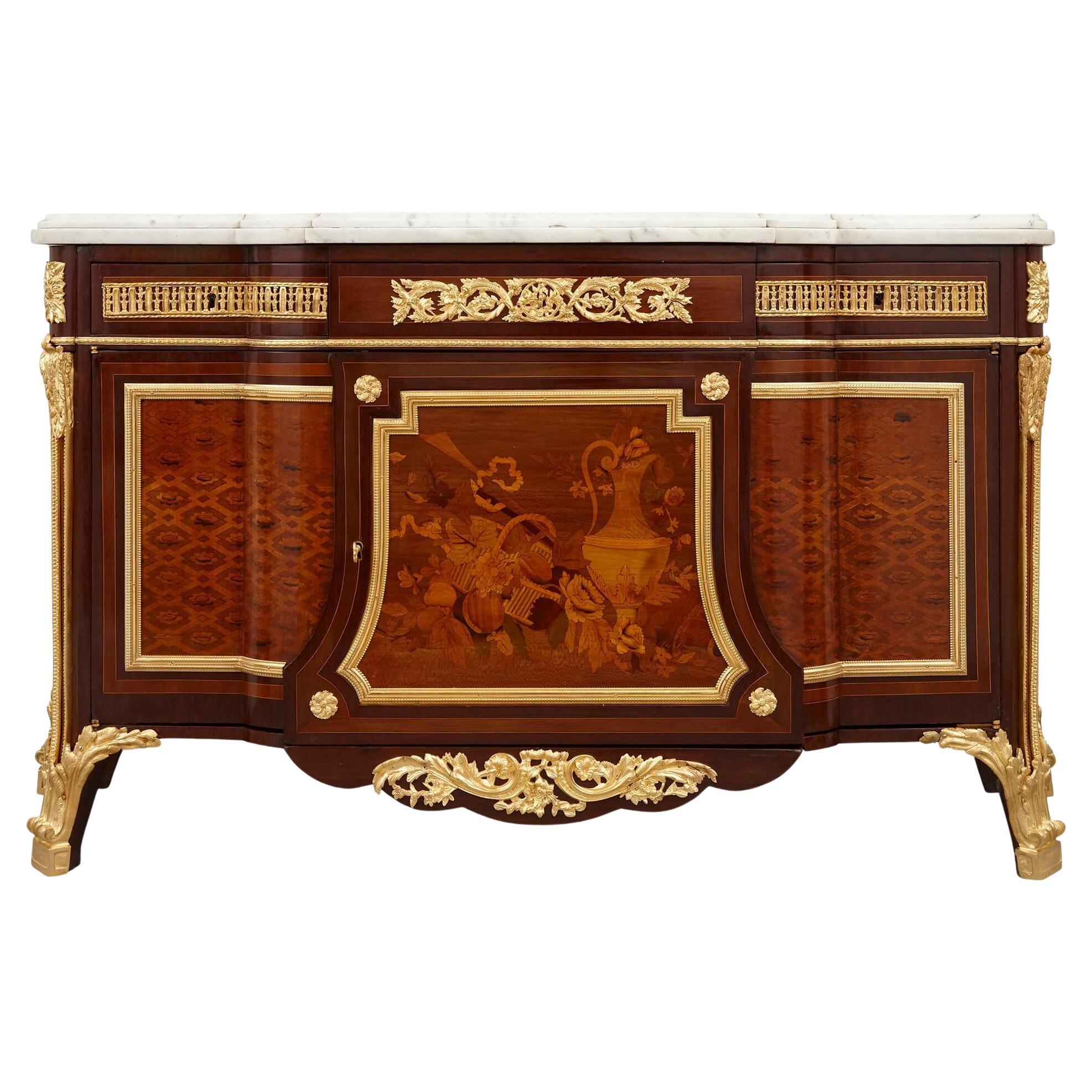 Très belle commode de style Louis XVI en marqueterie montée en bronze doré