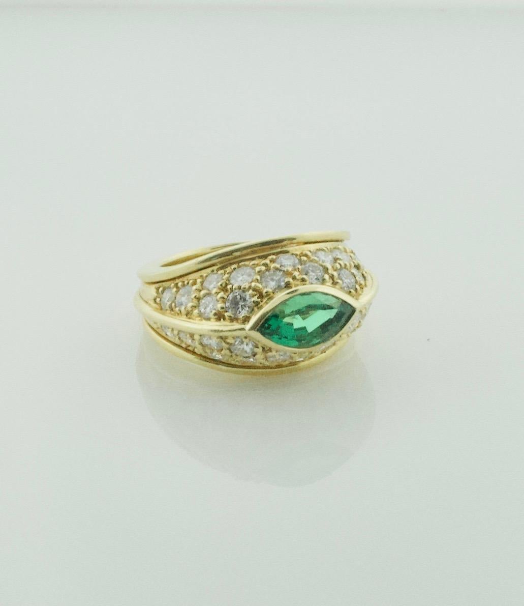 Very Fine Marquise Emerald and Diamond Ring in 18k
One Very Fine Marquise Cut Emerald Weighing 1.92 Carats [Vibrant Green with No Visible Imperfections]
Thirty Round Brilliant Cut Diamonds Weighing 1.94 Carats Approximately [GH VVS-VS]
A One of  a