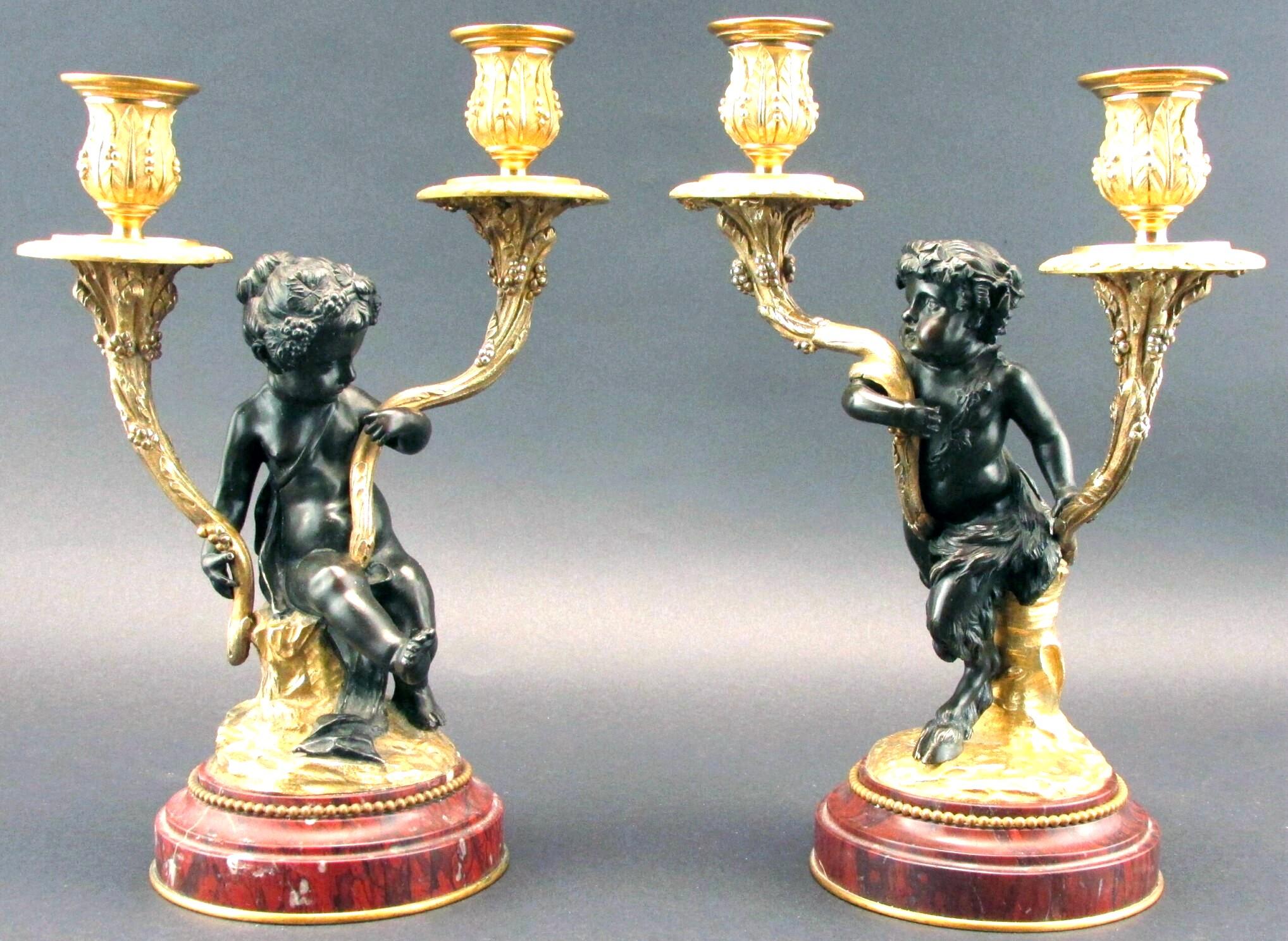 An exceptionally fine pair of 19th century patinated & parcel gilt bronze figural candelabra, executed in the Rococo manner closely associated with works by Claude Michel (Clodion) 1738-1814. 
Showing finely sculpted & patinated bronze figures of a