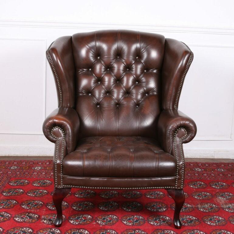 A very attractive pair of classic, English, button-tufted, leather Wingback armchairs in excellent condition. They’ve arrived here in a set with a matching leather sofa
