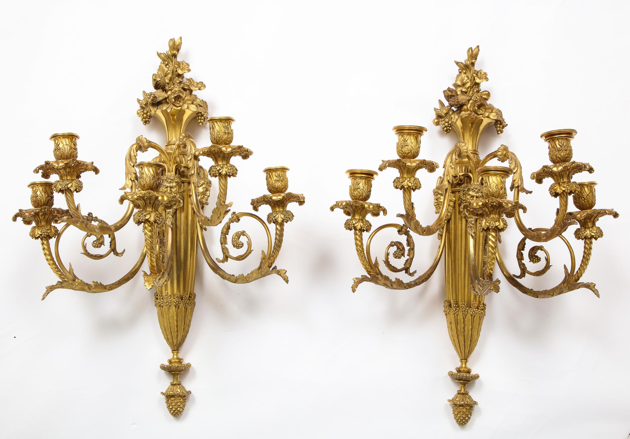 A very fine pair of Louis XVI style French ormolu bronze five-light wall appliques, sconces, Paris, circa 1870.

Attributed to Henry Dasson, after the model by Thomire.

Very high quality pair of wall-lights. Lots of detailing to every piece of