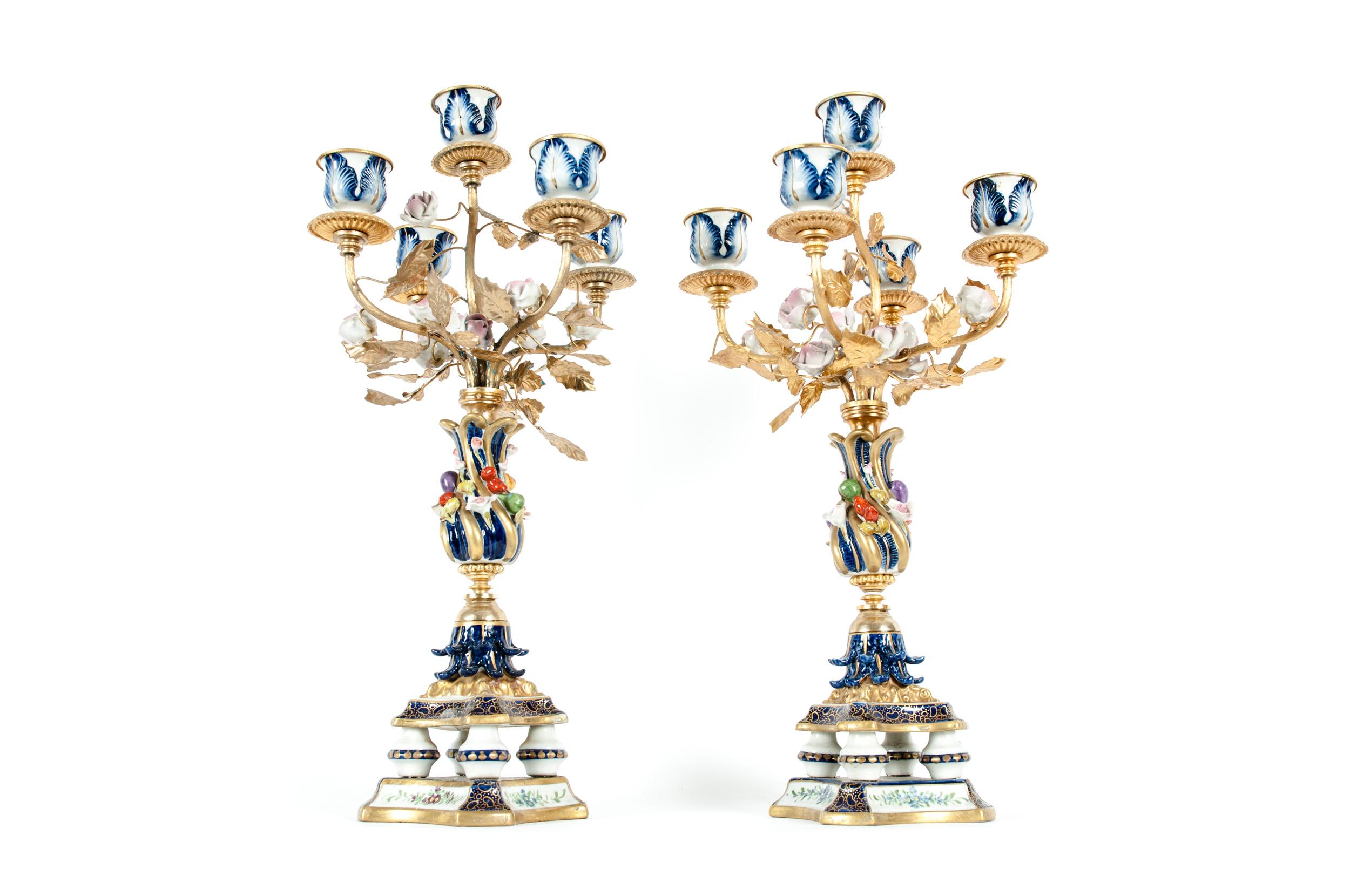 Very fine pair of Sèvres porcelain five arms candelabra with floral design details. Each candelabra is in great antique condition. Minor wear appropriate to age / use. Maker's mark undersigned. Each one measure about 18 inches high x 9 inches