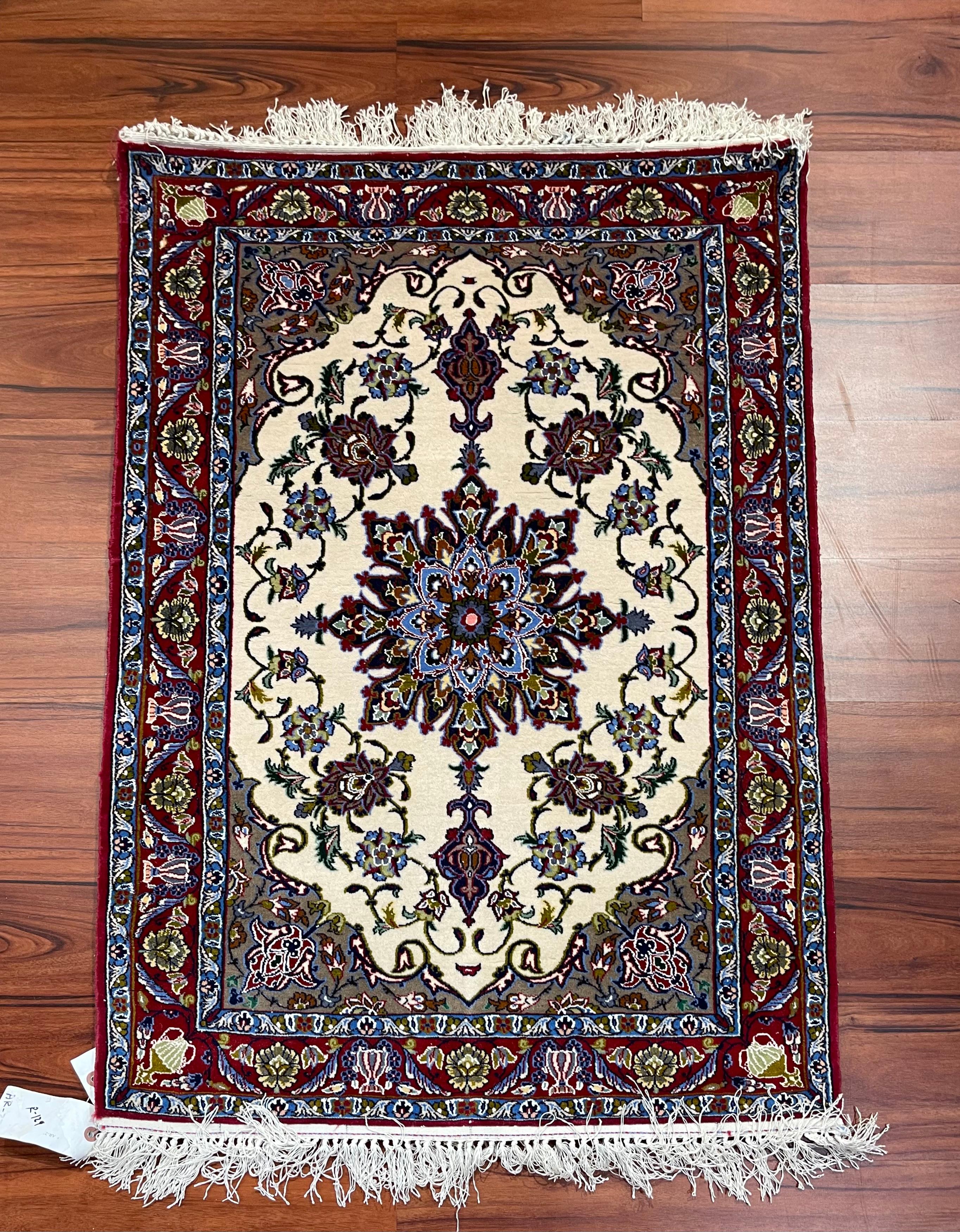 A stunning Persian Isfahan Rug originated from Iran. This hand-knotted piece is made from wool and silk and is in excellent condition. The dimensions are 2’3ft in width and 3’6ft in length.