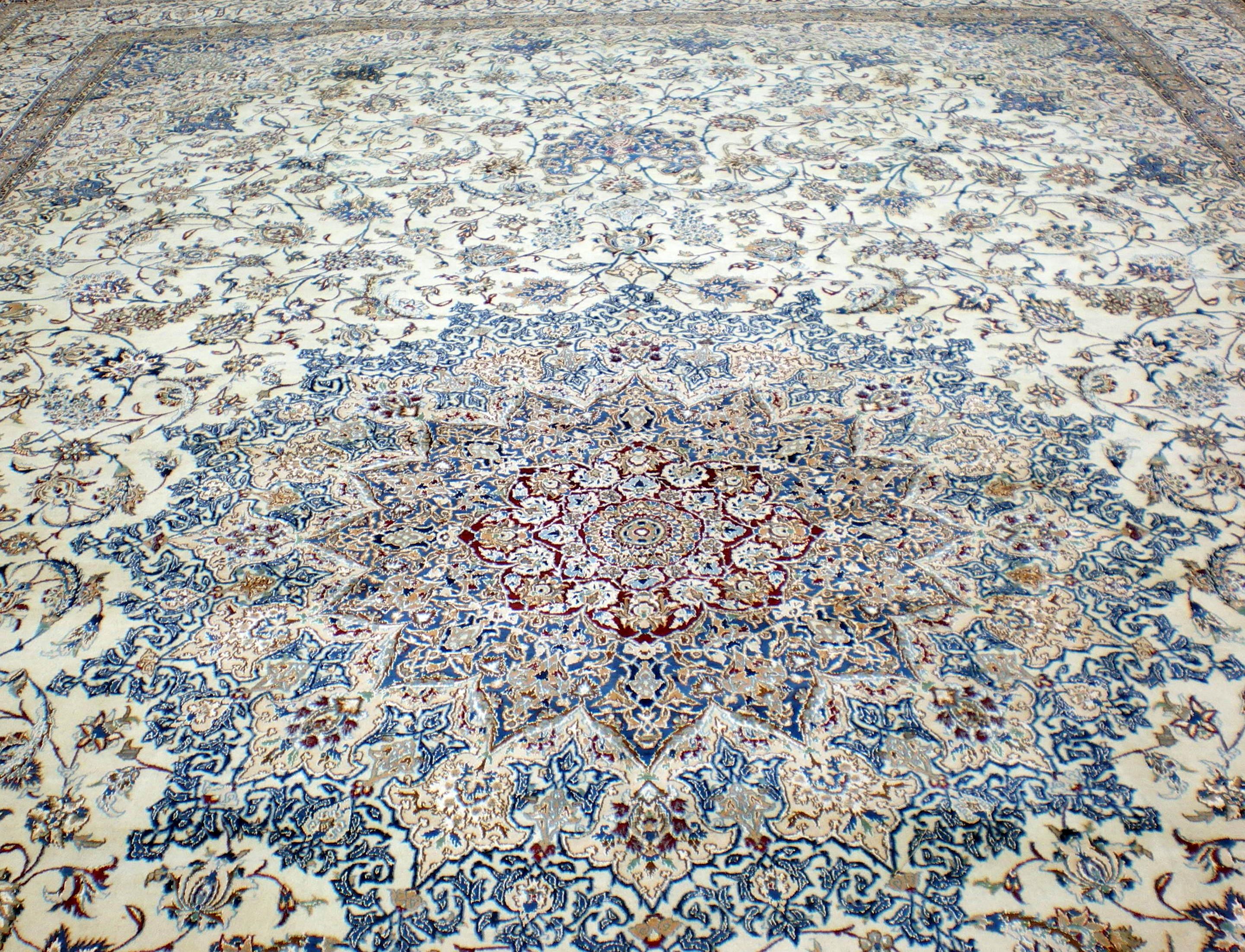 Very large Persian Nain wool and silk. Typical Nain with Ivory background with beige and different shades of blue.
It takes many years to finish this beautiful piece of art. 