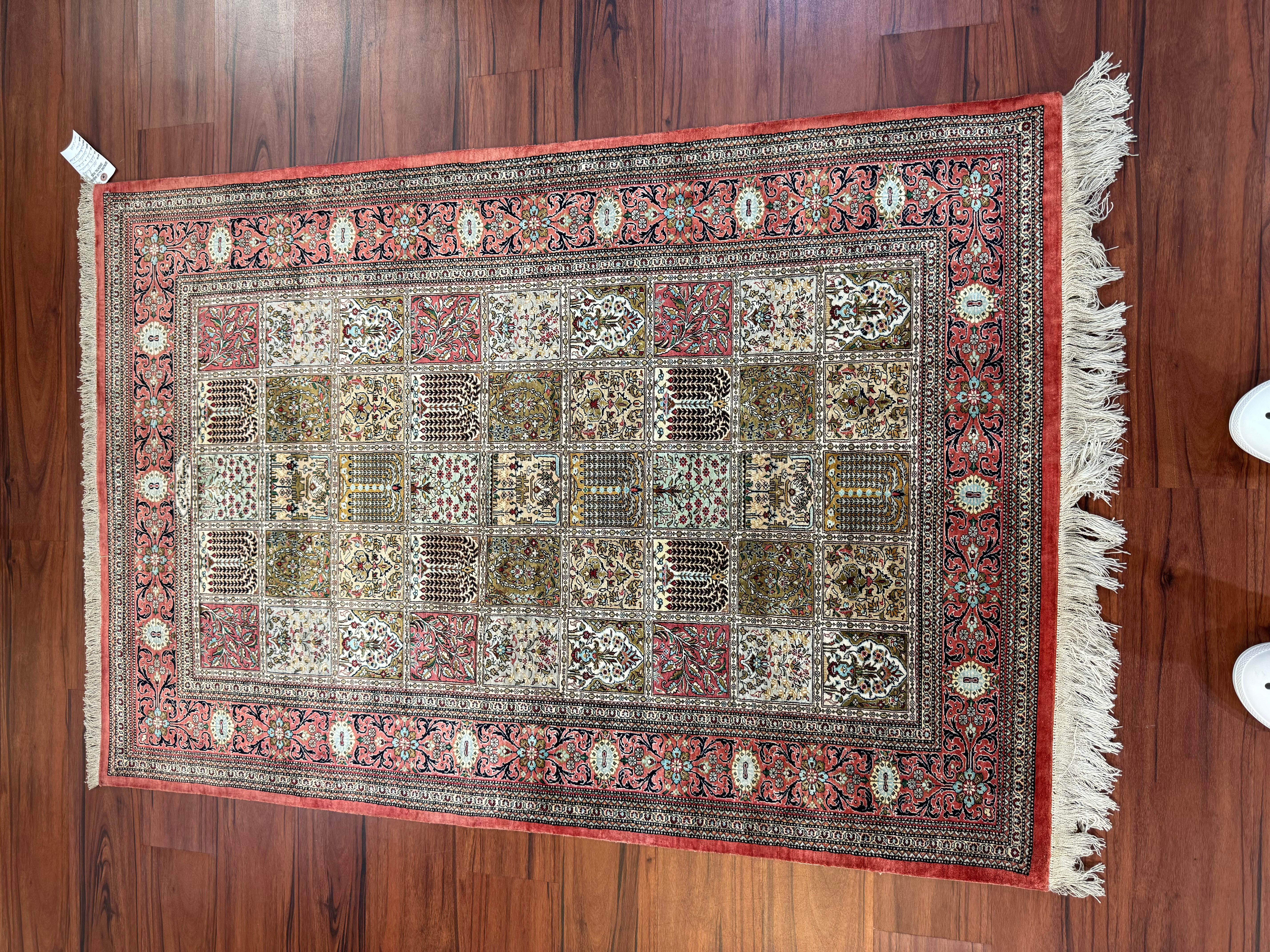 A stunning very fine Persian Silk Qum Rug that originates from Iran in the late 20th century. This rug is in excellent condition considering its rich history and is made from 100% silk. Feel free to message me in regards to this listing or any other