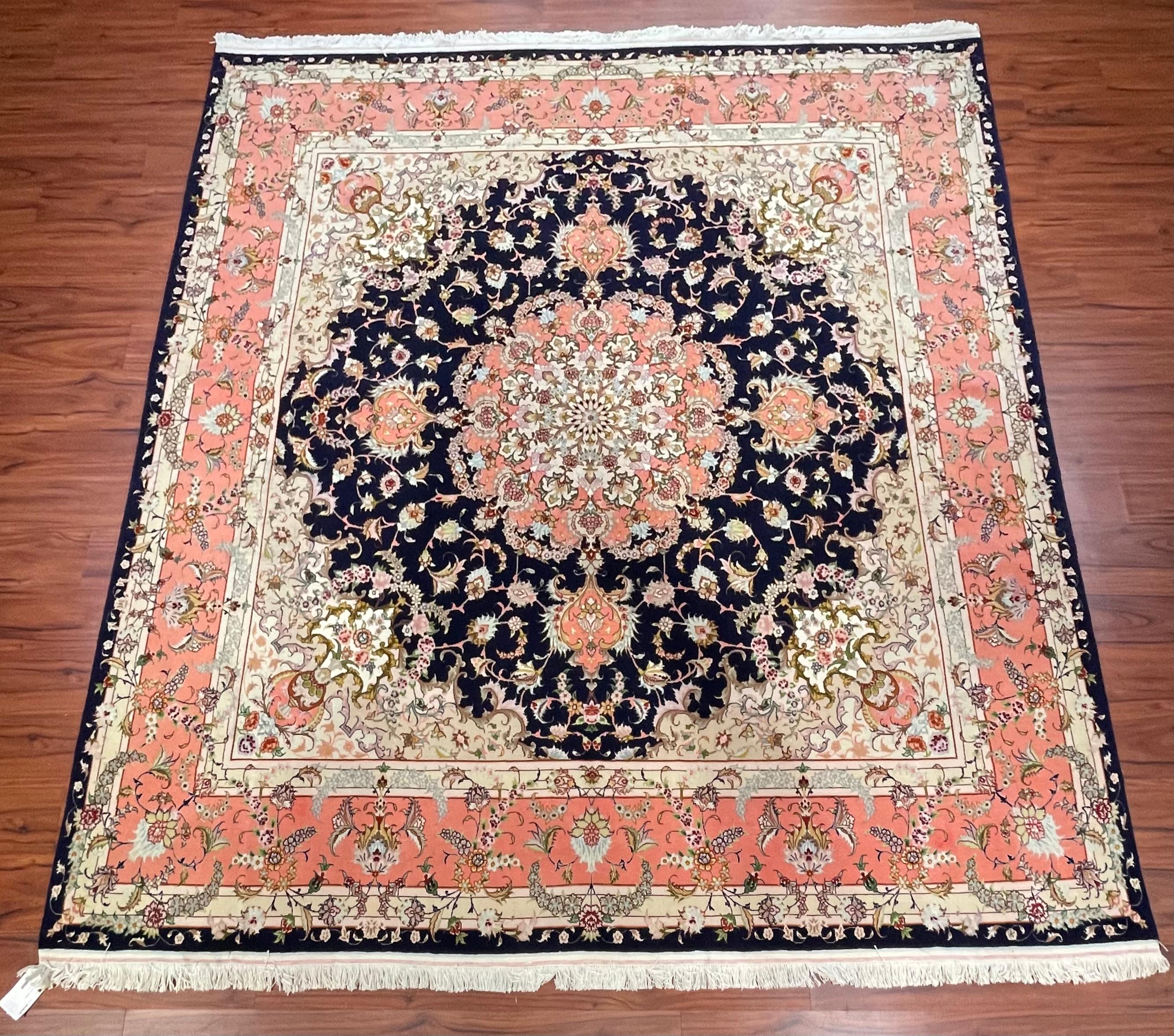 A stunning Persian Tabriz Rug originated from Iran in the late 20th century. This piece is hand-knotted and is made from a wool and silk blend. This Tabriz rug is in absolute excellent condition. Feel to message me with questions regarding this rug