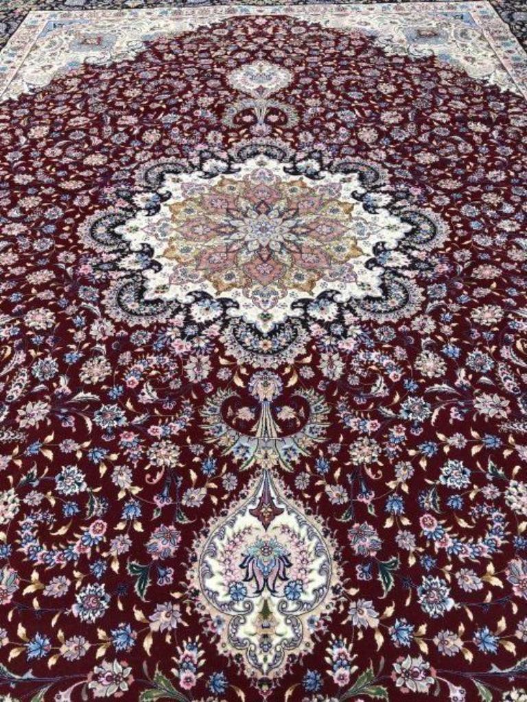 Magnificent Persian Tabriz wool and silk pile with silk foundation.  This rug has approximately 625 knots per sq inch with a total of 17,000,000 knots tied by hand one by one. It took 9.5 years to complete this beautiful piece. It is signed by