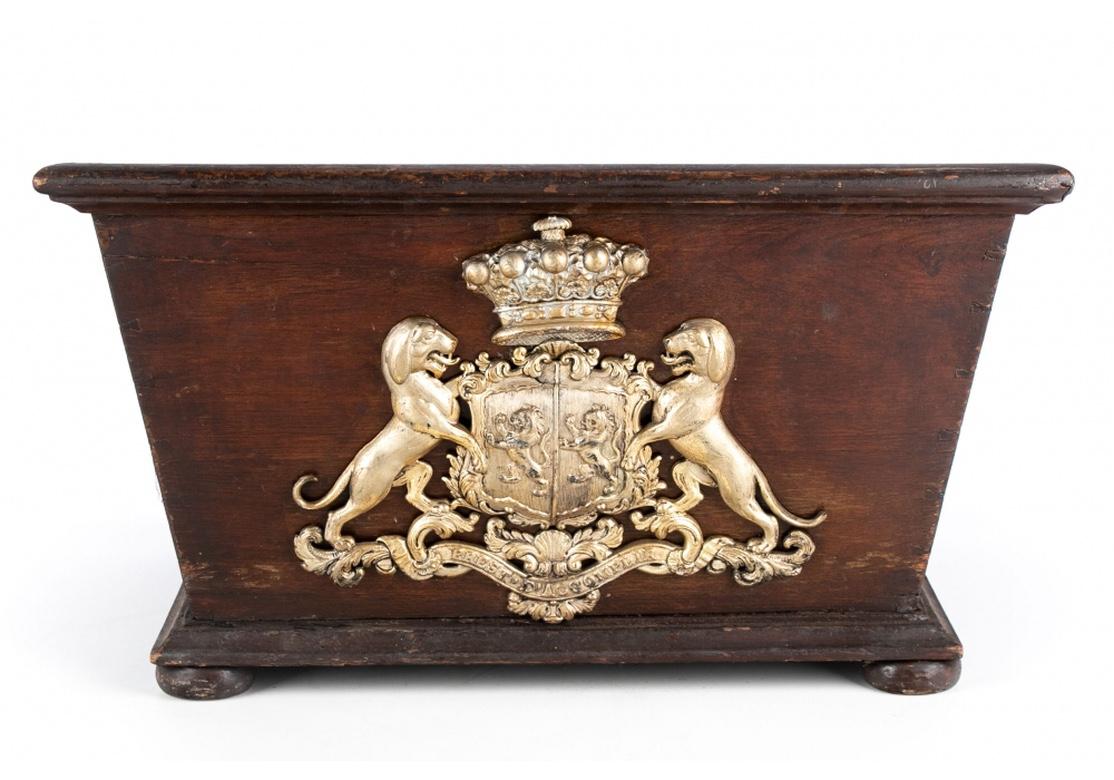 A rare matched pair of angled wood period Georgian wine coolers in all original condition with lion, dog and crown front shields and copper liners. The pair feature very good craftsmanship with visible minute joinery and bun foot.
Overall good