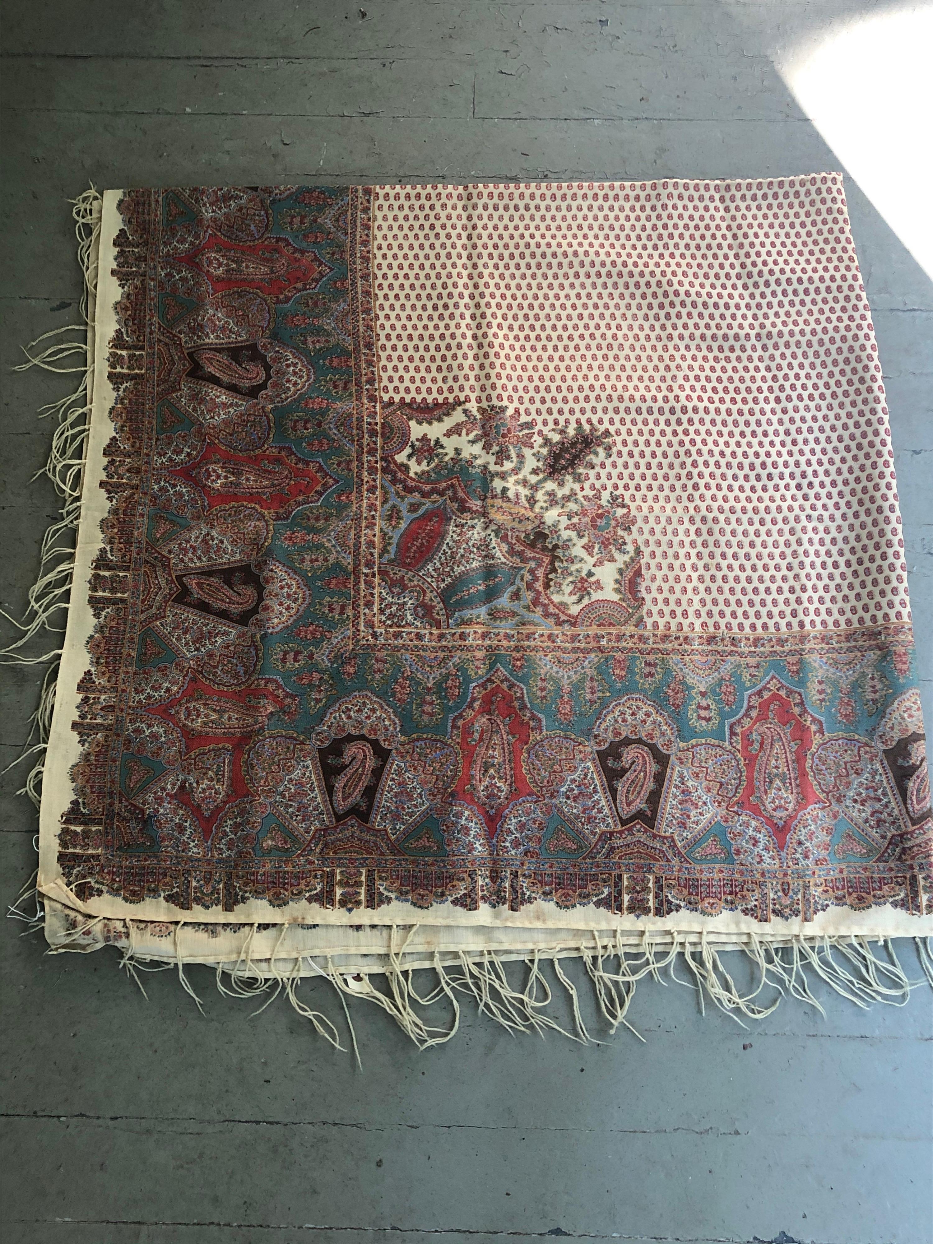 Very finely woven wool printed paisley throw. Probably French. A few small stains
and some wear spots, but in overall very good condition. Nicely twisted fringe.
