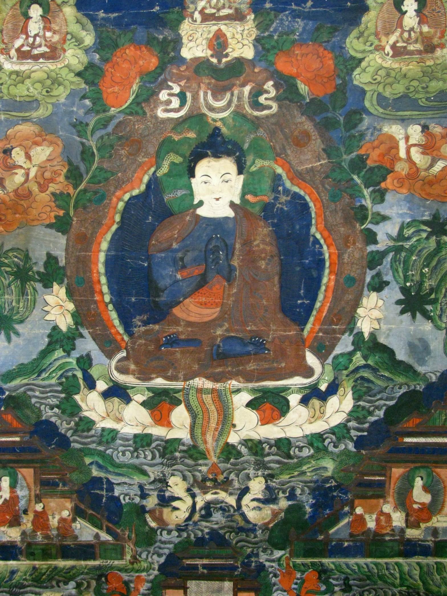 A striking 19th century Tibetan thangka of the enlightened one, Buddha Nagaraja; King of Nagas (a.k.a. Buddha Nageshvara). Shown seated in the vajra position atop a lotus blossom, hands clasped in front of his heart in ‘Enlightened Mudra’, his head